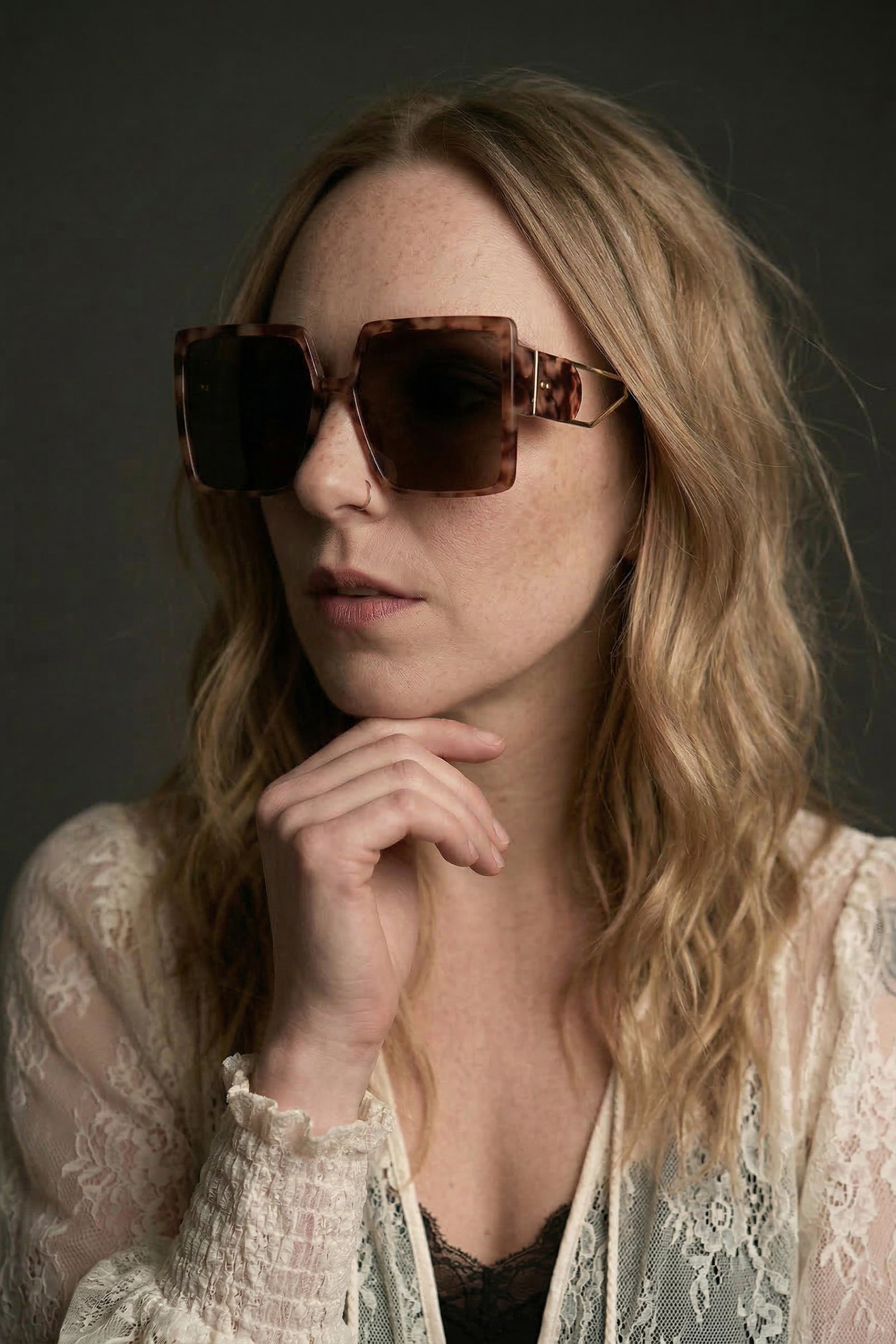 Model wearing oversized square tortoiseshell retro sunglasses with bold frame styled with Rhiannon Ivory lace Kimono