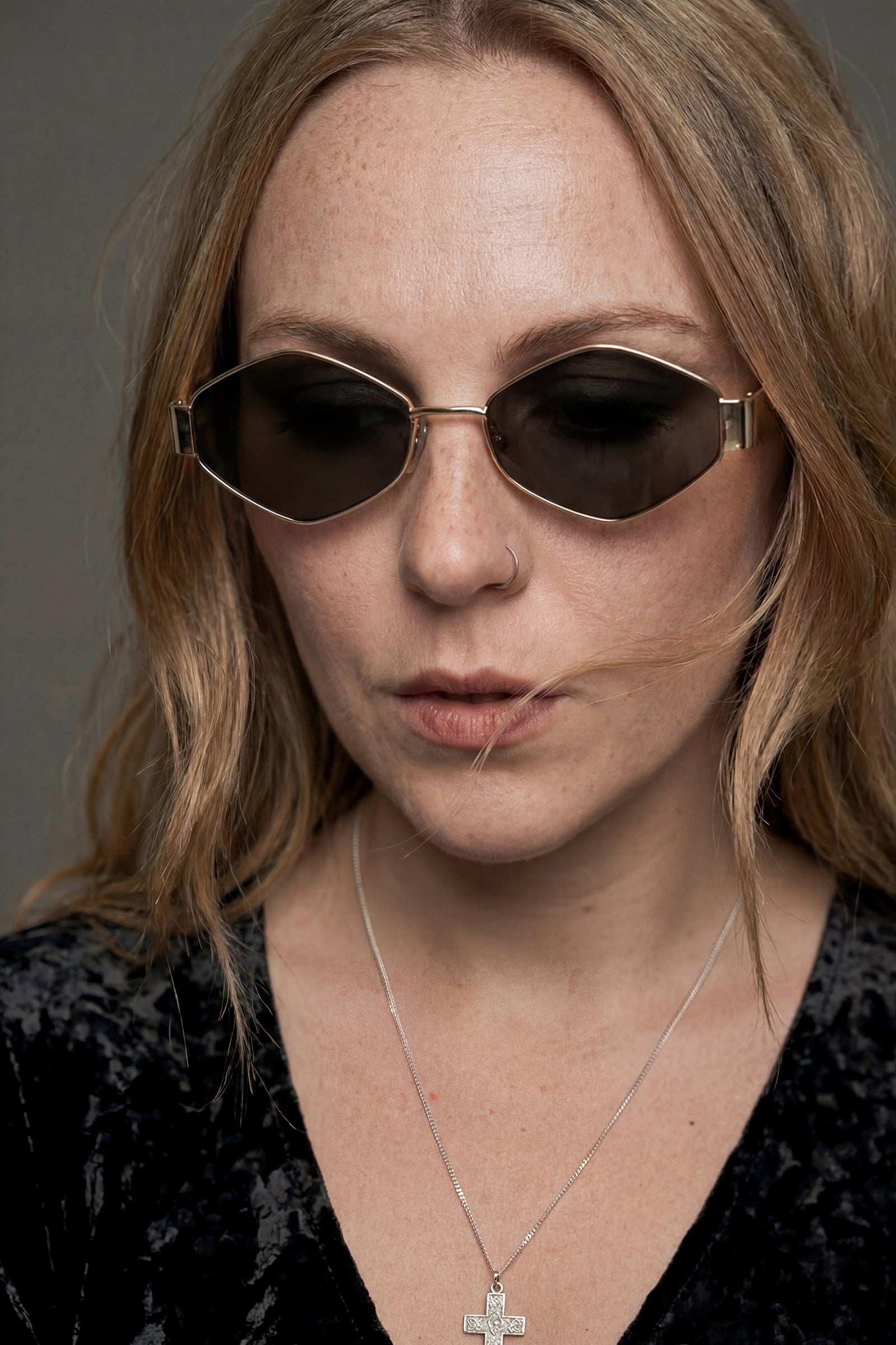 Model wearing Ava slim oval metal sunglasses styles with Dylan Velvet Top