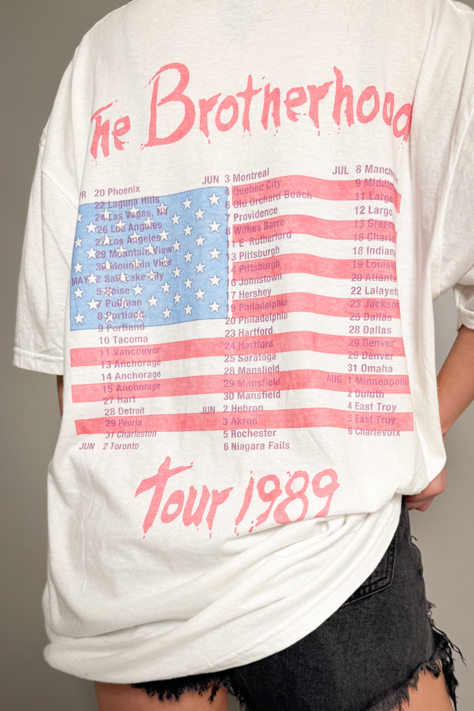Back view of Little Lies Bon Jovi The Brotherhood tour band tee with American flag graphic and 1989 tour dates in vintage wash finish