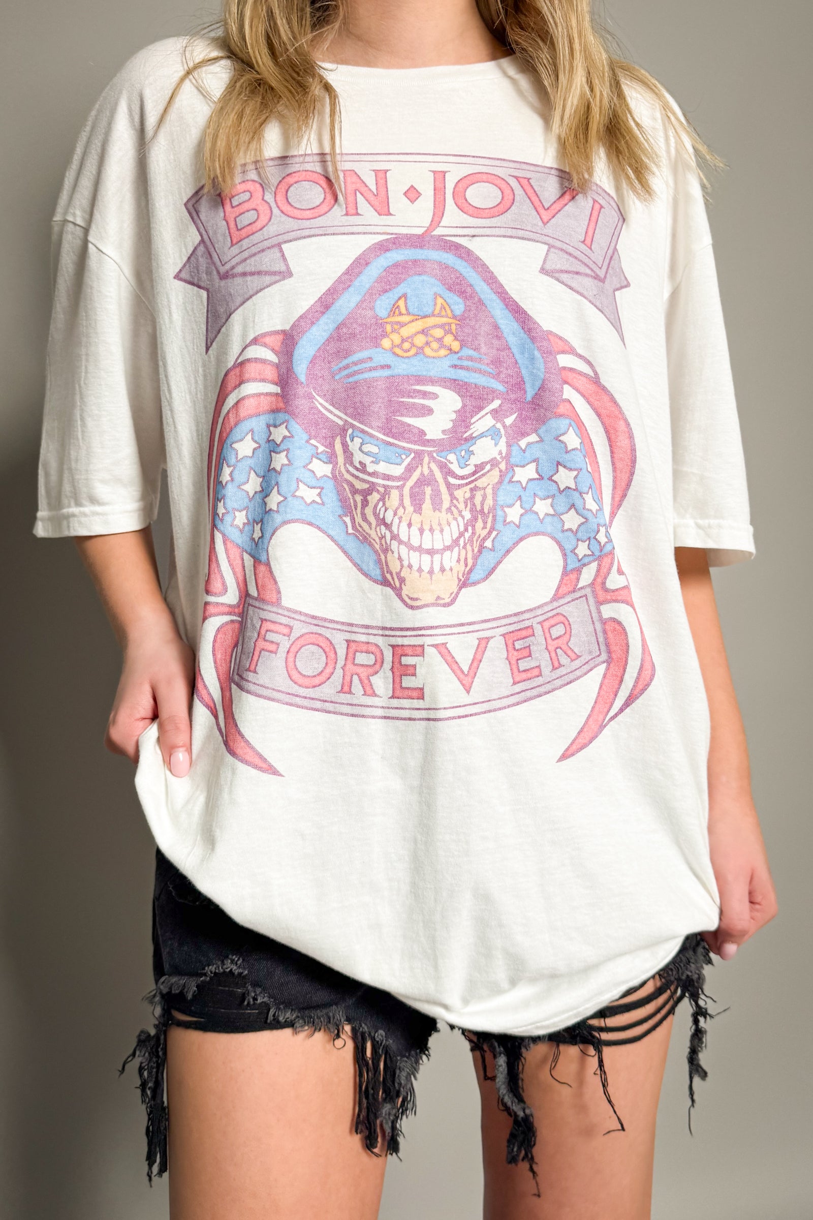 Little Lies Bon Jovi The Brotherhood band tee in off-white with vintage-style skull and blue guitar graphic and relaxed oversized fit