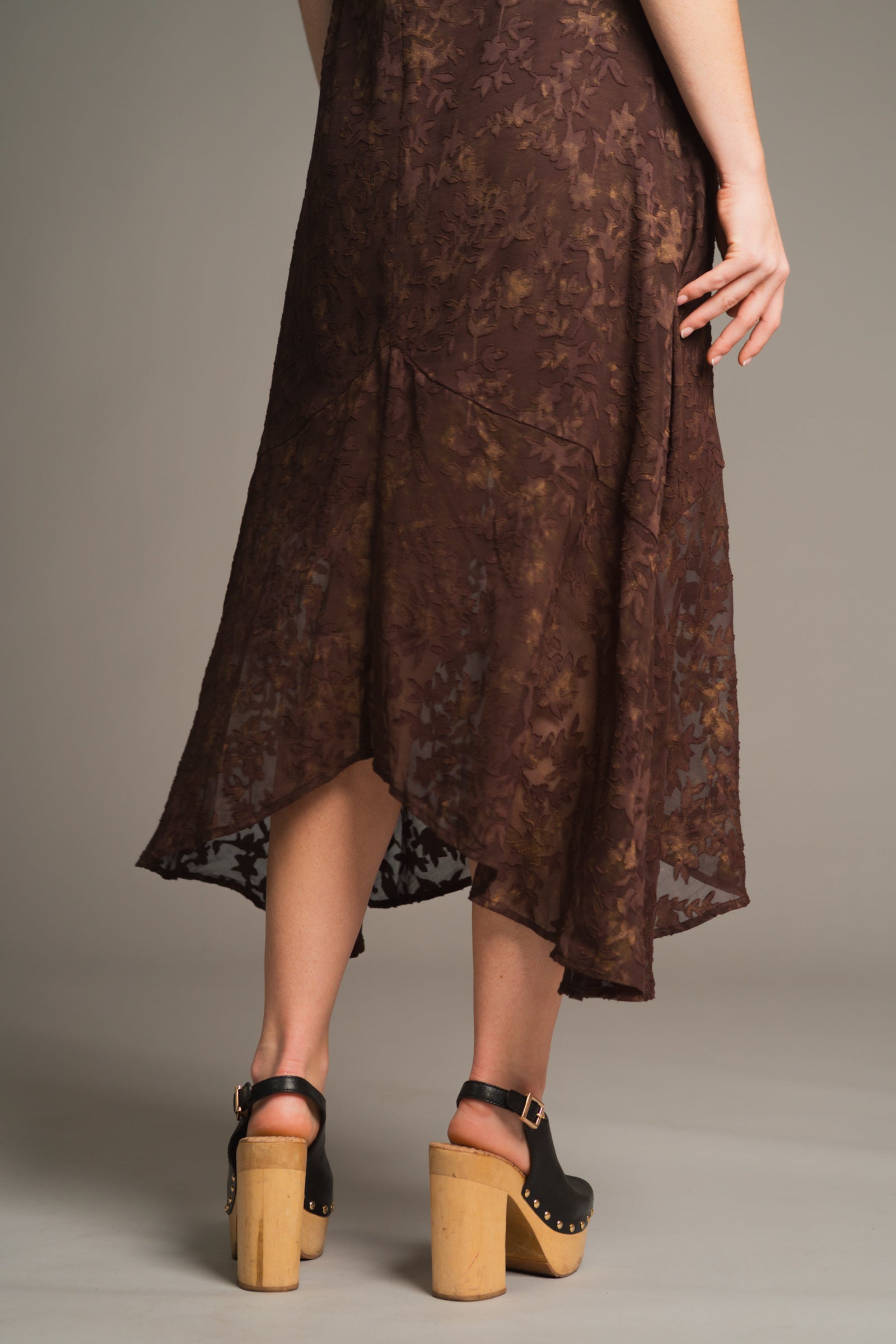 Anna showing the back of the Brown Sugar cape maxi chiffon dress, hem detail. Stevie nicks inspired styling studio