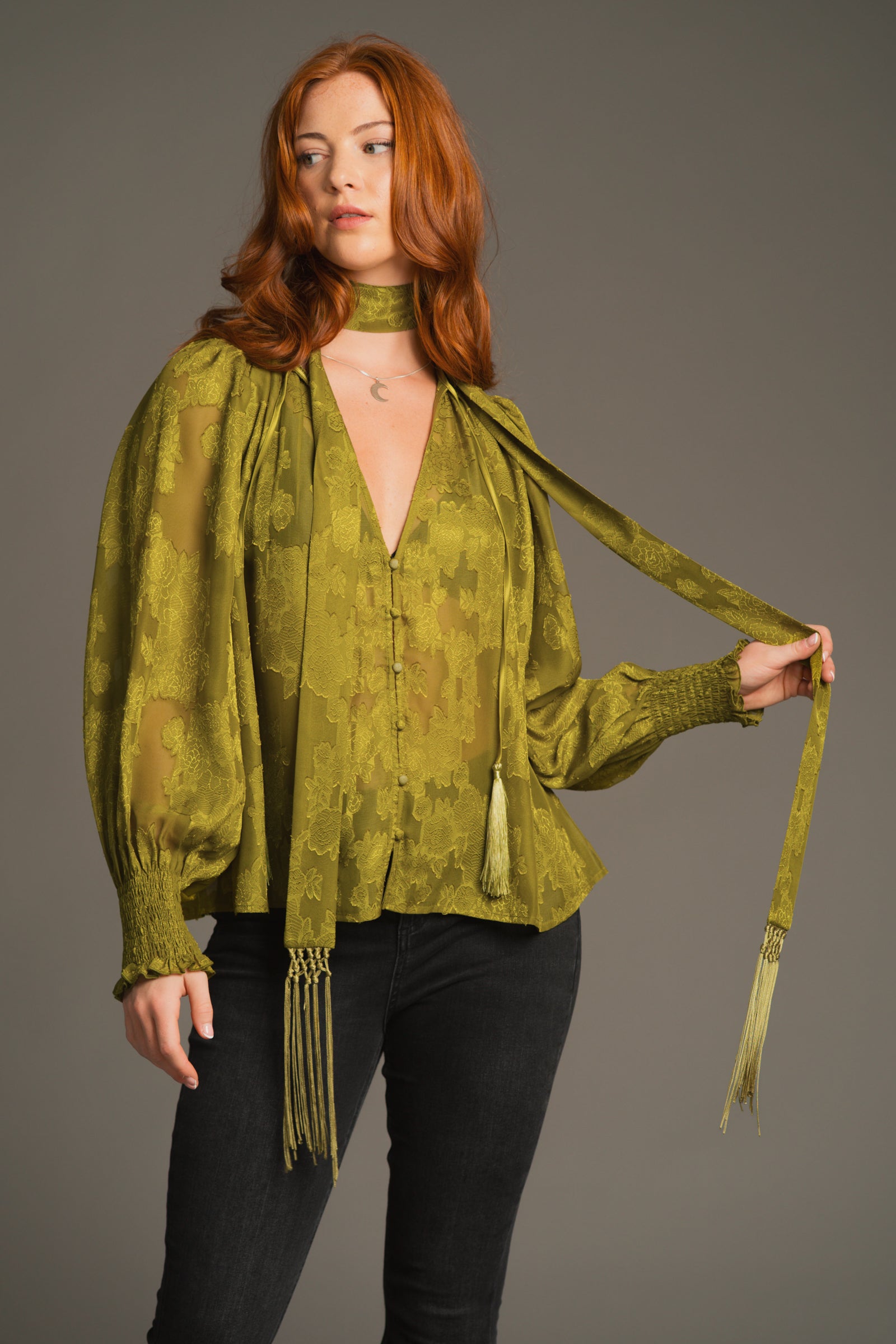 Red-haired Anna, styling olive skinny scarf with green Cassia Smock Top for co-ord look