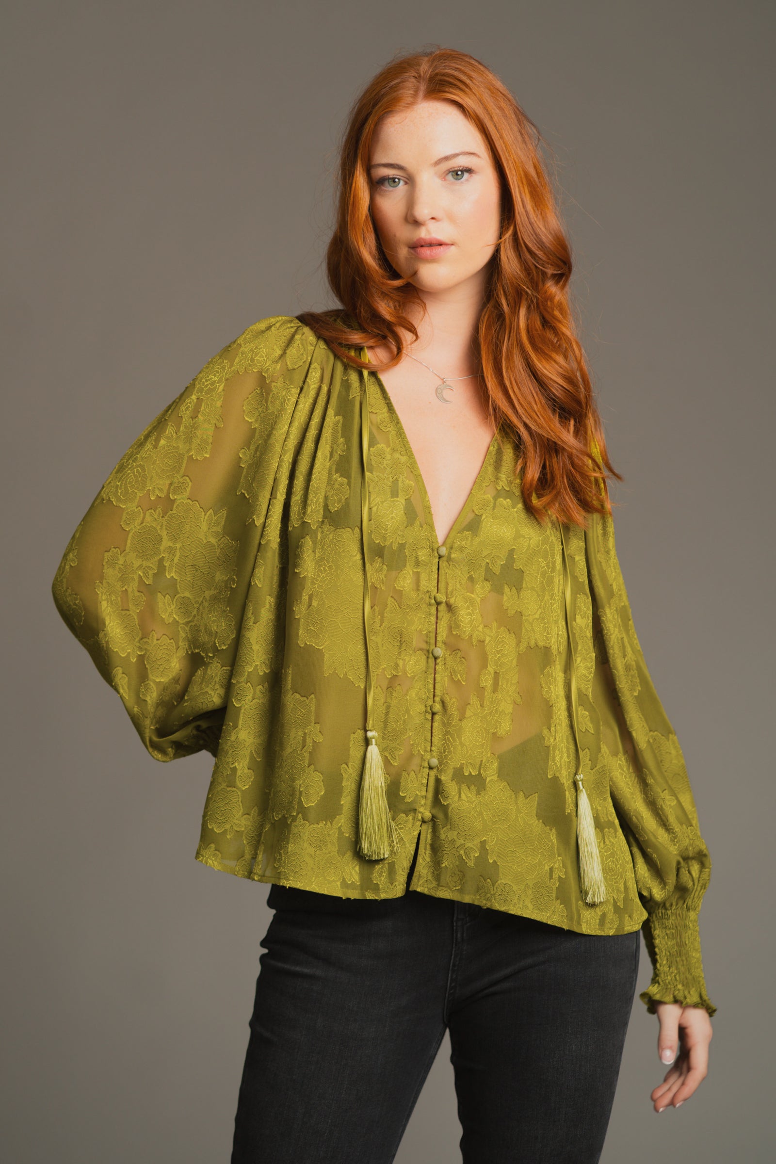 Lifestyle pose emphasizing relaxed fit and boho-inspired styling of the Cassia Olive Smock Top