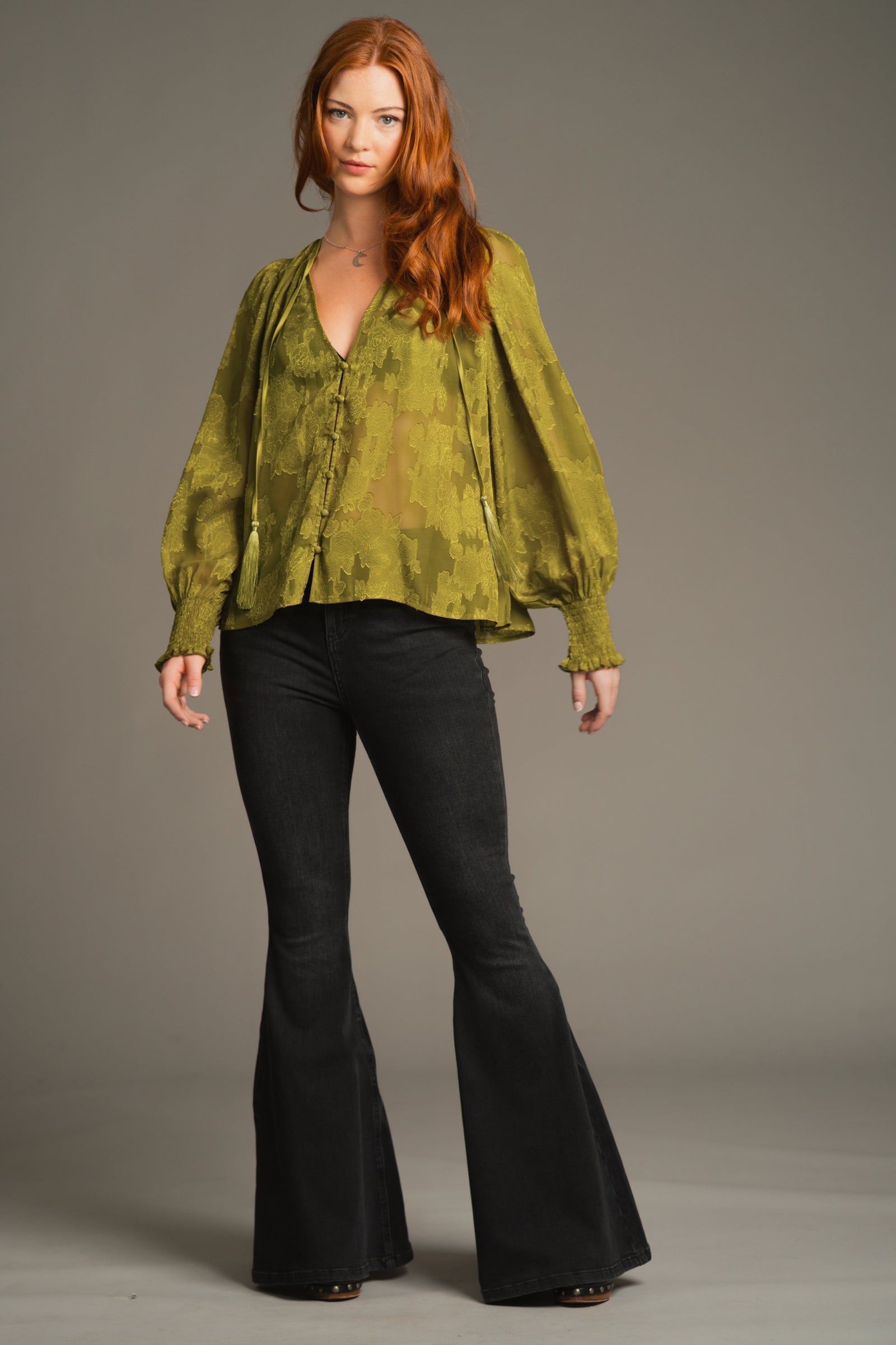 Lifestyle pose emphasizing relaxed fit and boho-inspired styling of the Cassia Olive Smock Top