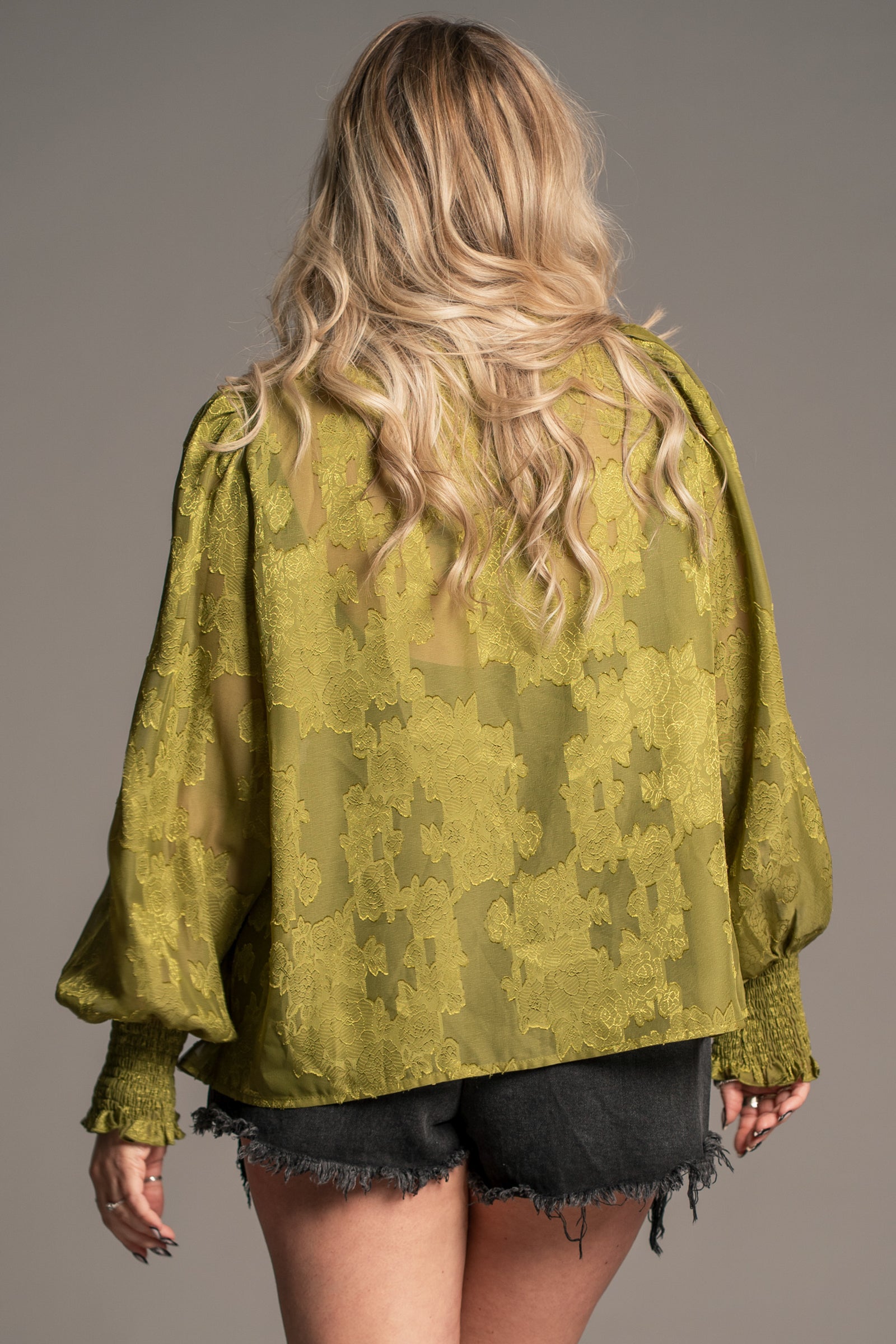 Little Lies Cassia olive chiffon smock top with floral texture and flowy silhouette, on‑model back view