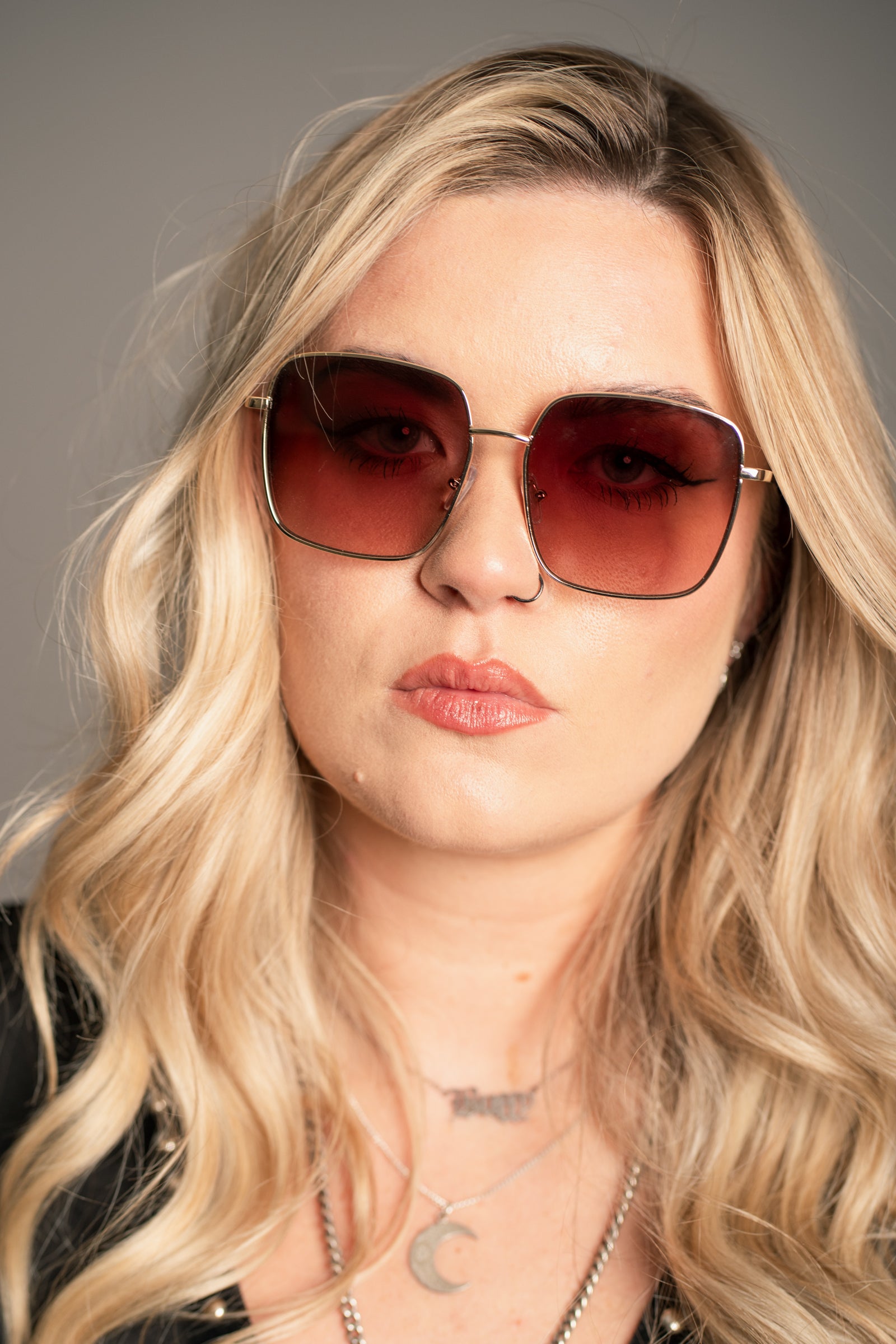 Side profile of Little Lies Cher Oversized Square Sunglasses showing gold-tone frame and gradient lens depth