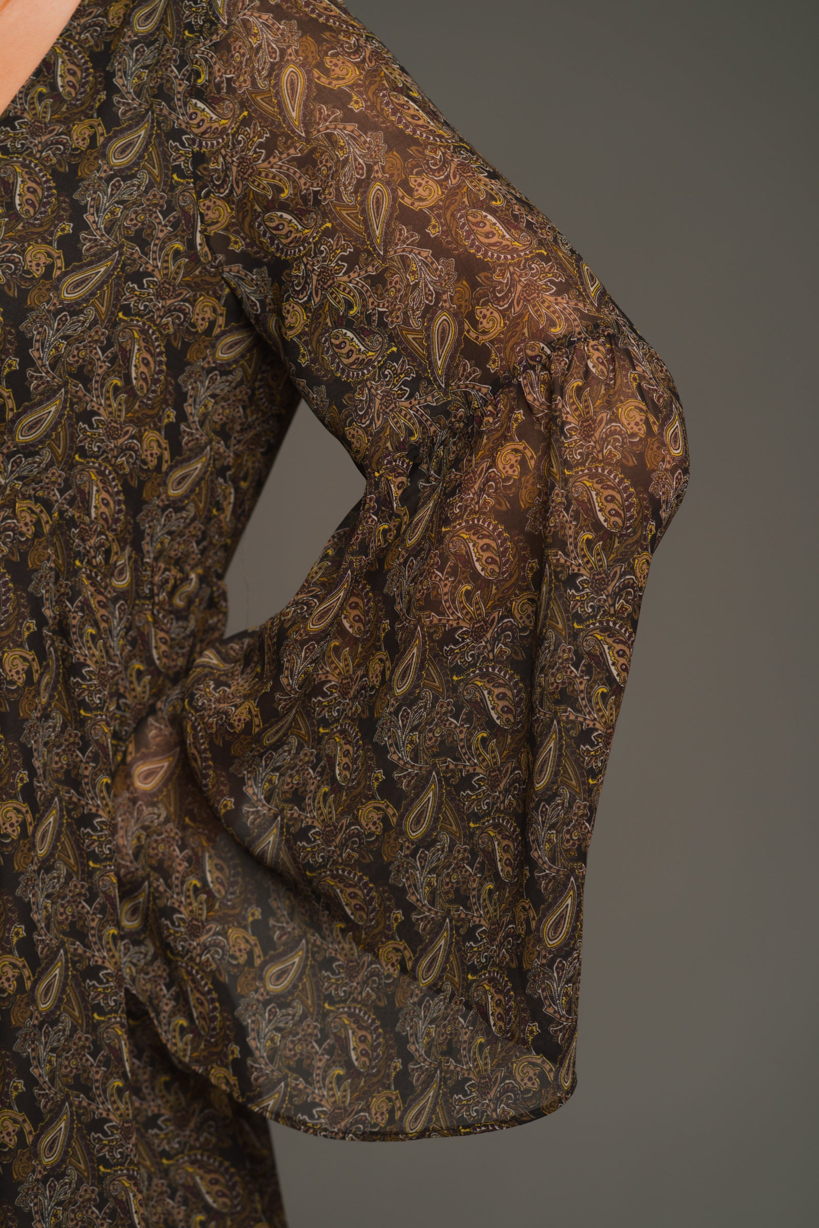 Close-up of Cinnamon Girl Paisley Chiffon Smock Dress fabric in deep neutrals with olive and brown paisley texture