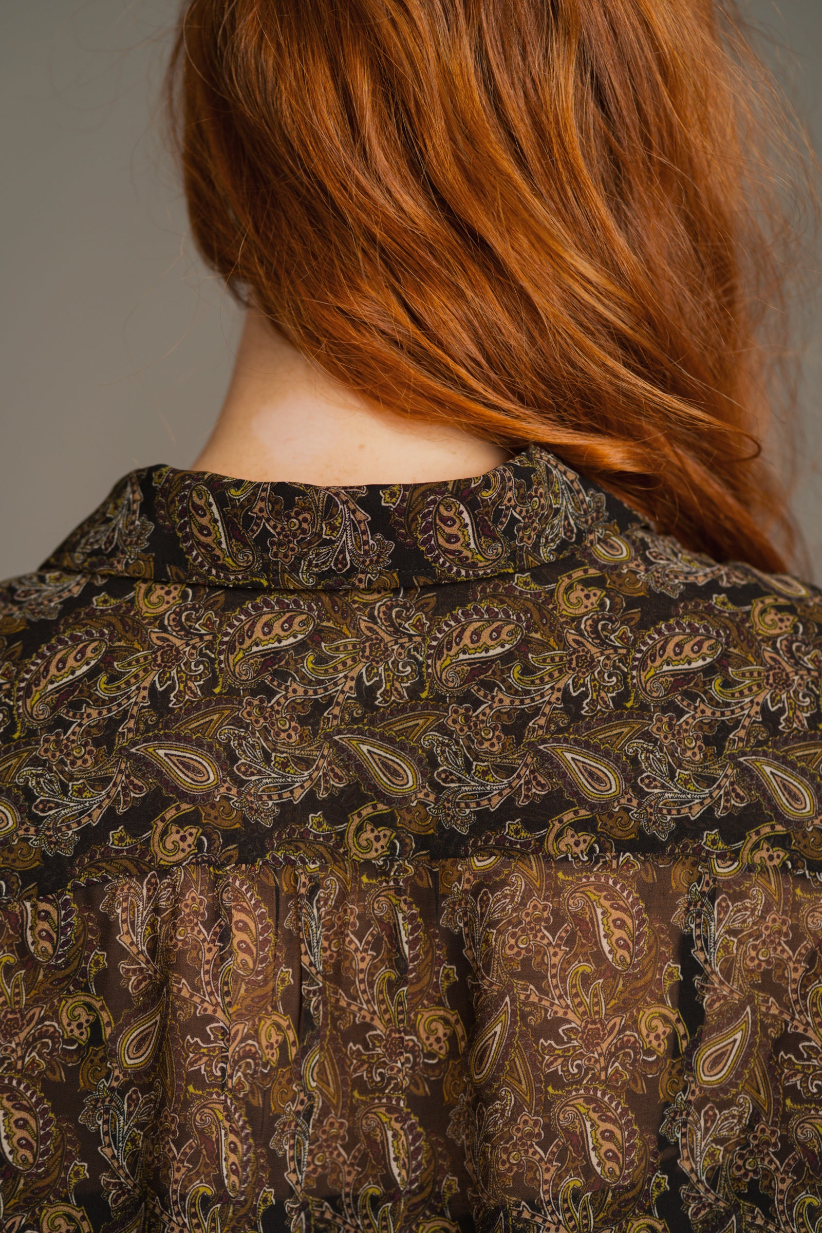 Back view of Cinnamon Girl Paisley Chiffon Shirt showing relaxed fit and semi-sheer paisley chiffon