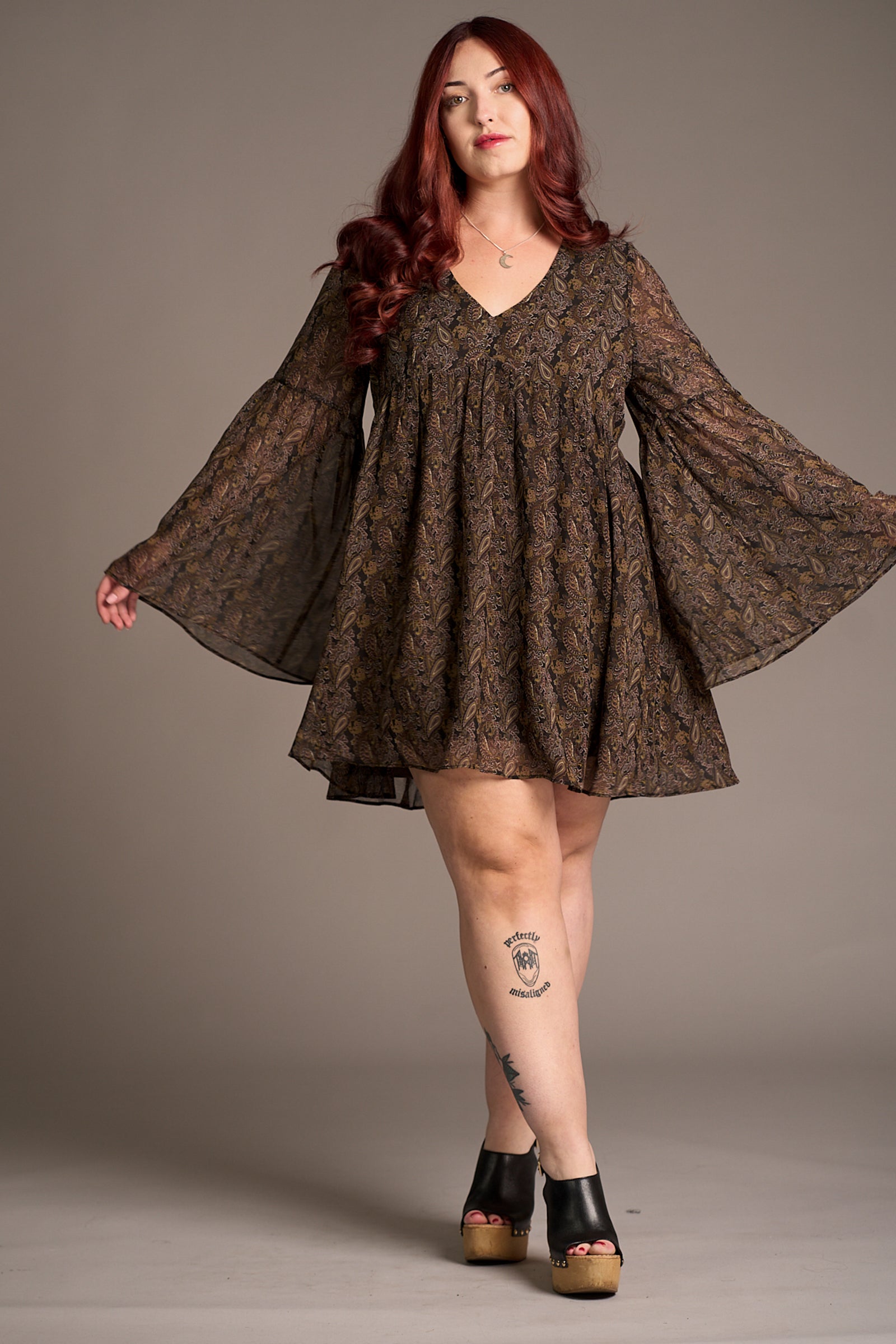 Taylor wearing the Cinnamon Girl Paisley Chiffon Smock Dress, with flared wide sleeves. Stevie Nicks inspired styling studio.