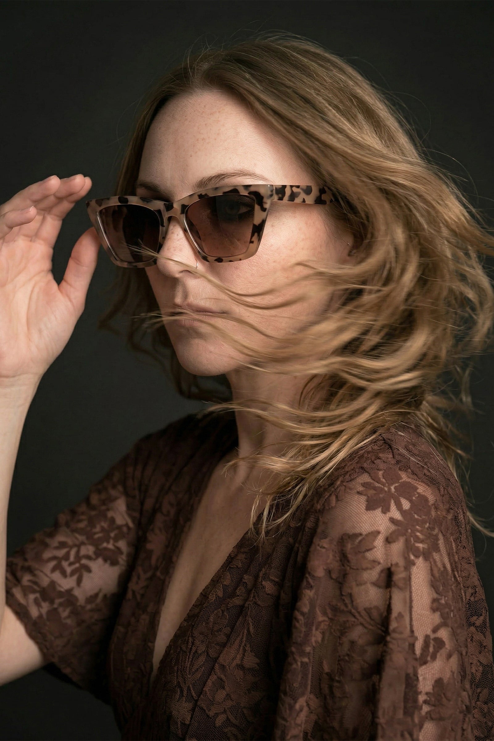 Model wearing cat eye tortoiseshell retro sunglasses styled with Brown Sugar Lace Dress