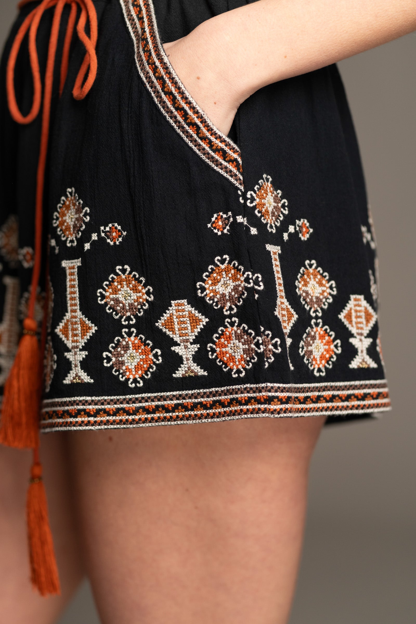 Side view of Little Lies Anita Embroidered Shorts showing double cheesecloth fabric and removable belt