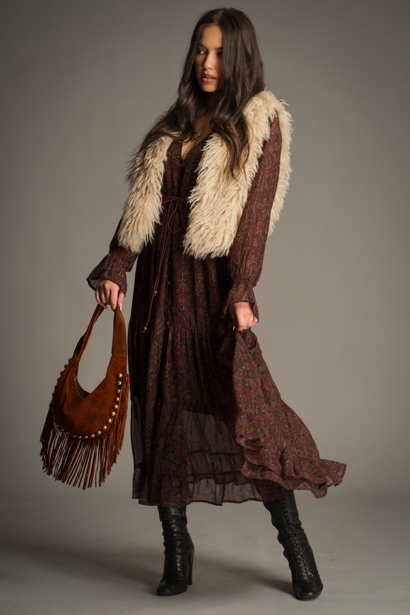 Penny Lane Faux Mongolian Fur Gilet by Little Lies layered over the Dark Paradise Paisley Maxi Dress, featuring bohemian autumn styling, faux fur texture and a vintage-inspired paisley print
