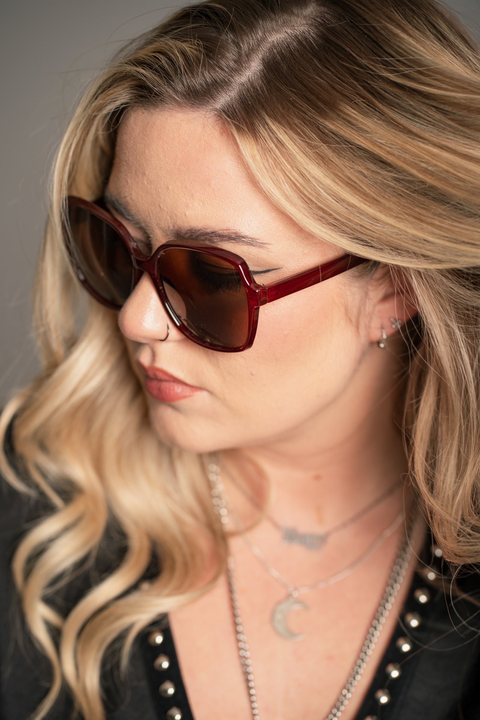 Side profile of Little Lies Diana Crimson Red Retro Sunglasses showing oversized geometric frame shape