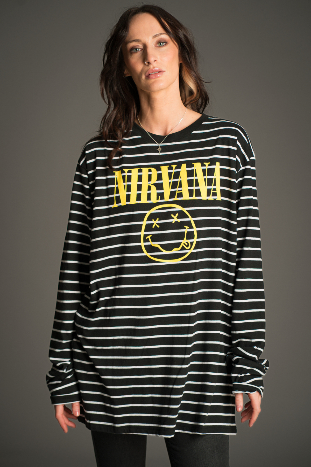 Nirvana striped long sleeve T-shirt with smiley logo front view styled with Hendrix Denim Flares.