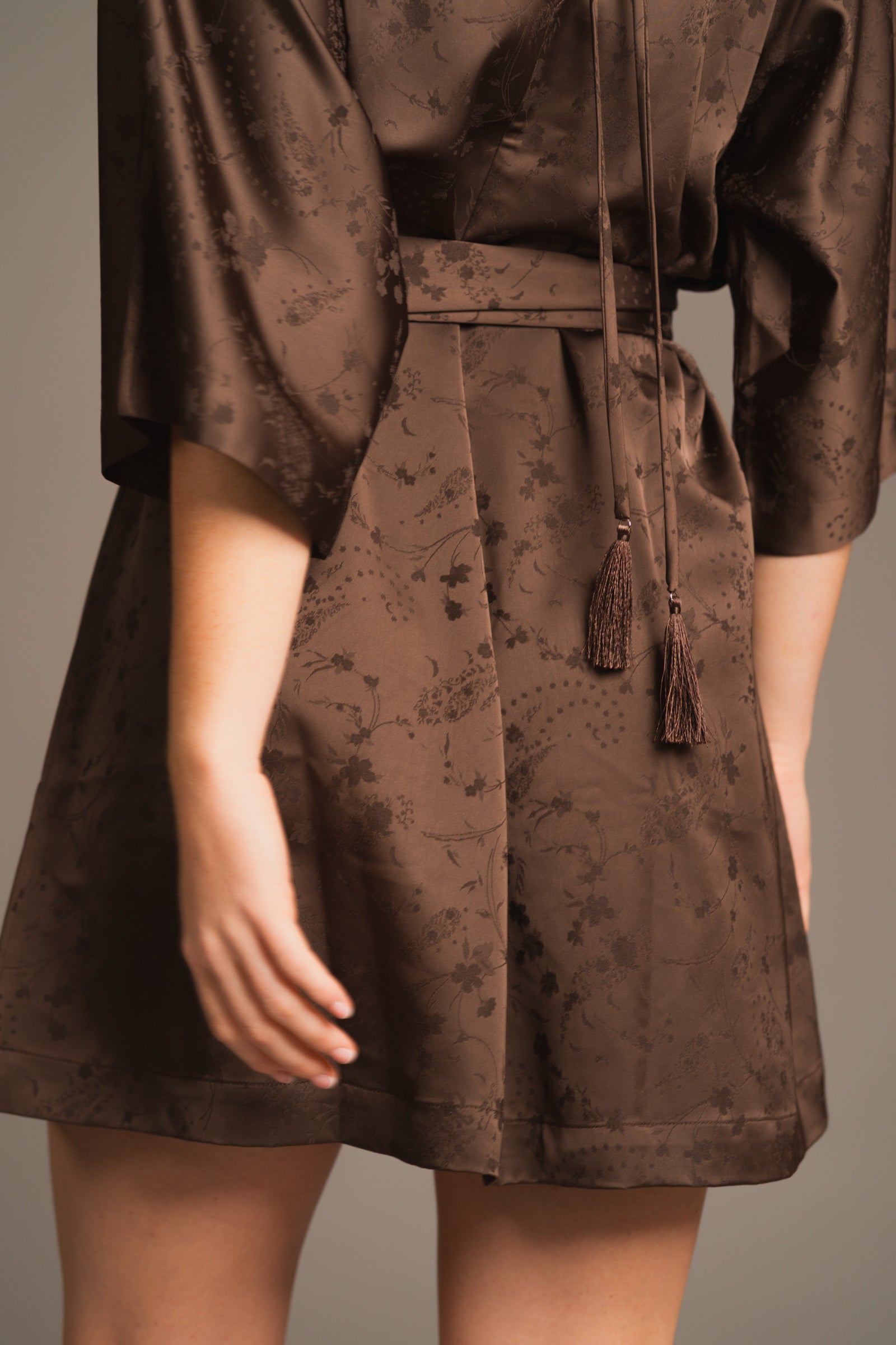 Back view showing the Evermore dress’s soft drape and lightweight textured fabric