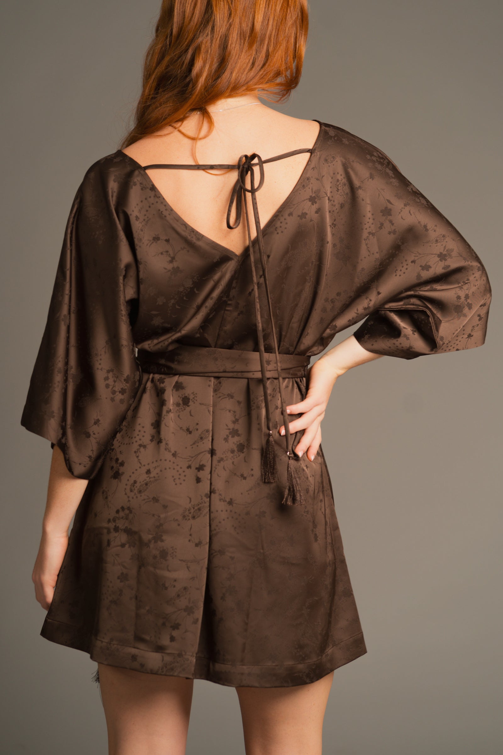 Back view showing the Evermore dress’s soft drape and lightweight textured fabric