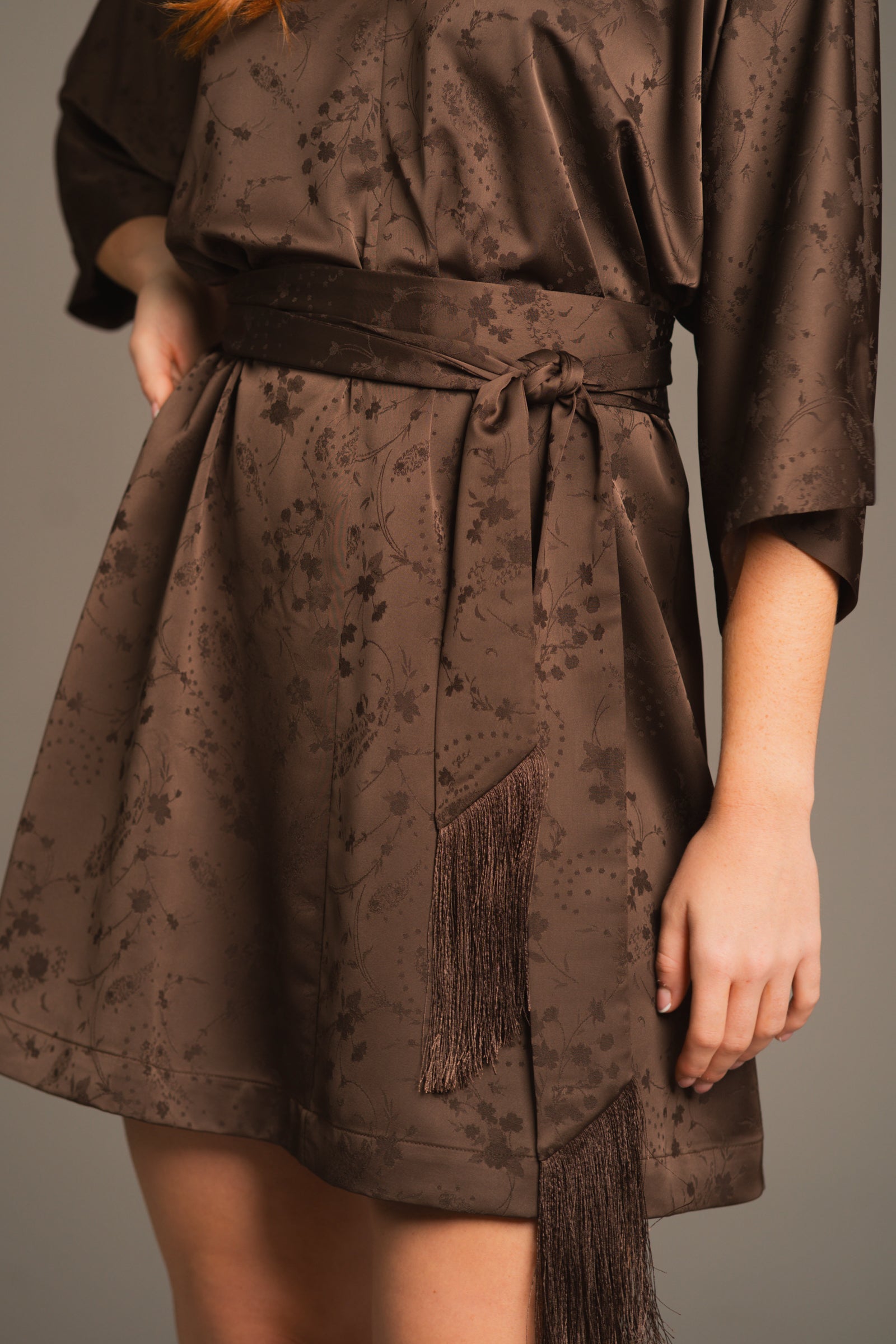 Close-up of belt detail and subtle pattern on the Evermore Espresso brown dress