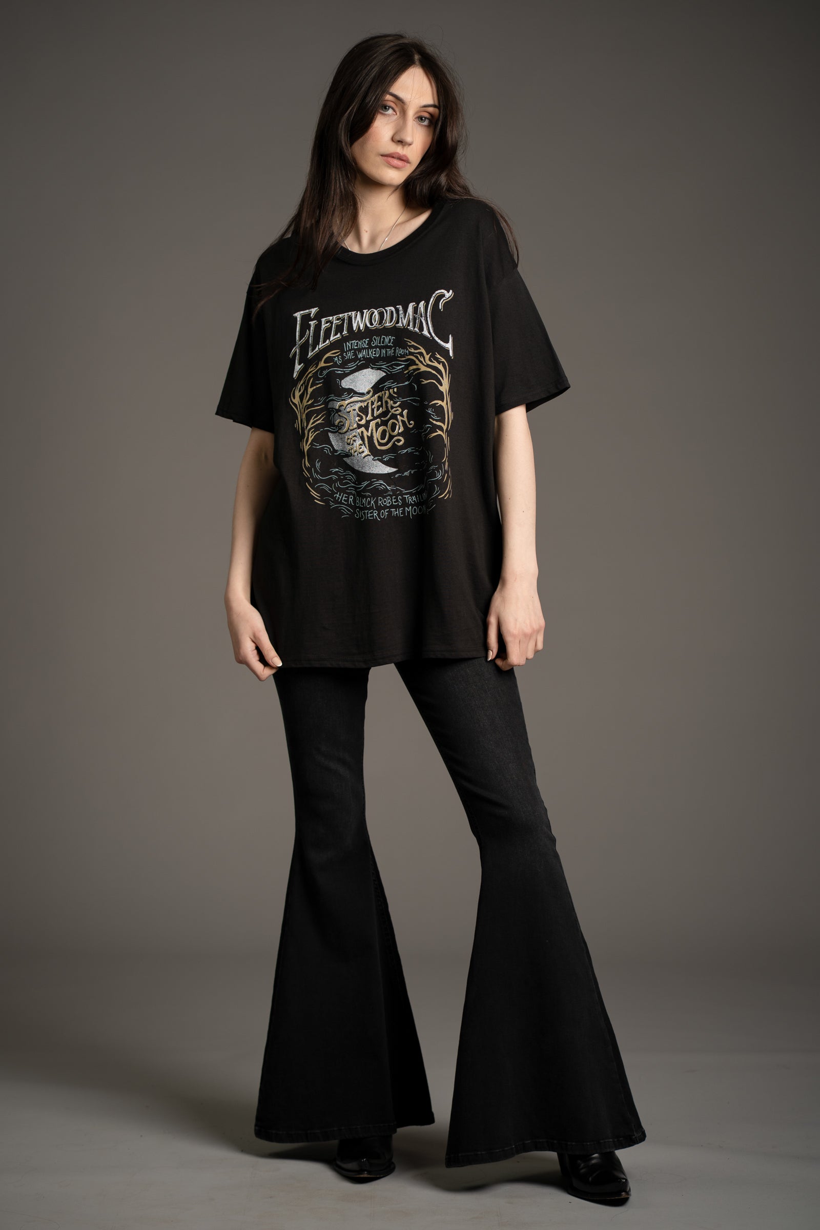 Model Andie wearing the Fleetwood Mac Sisters of the Moon Band graphic tee styled with Hendrix denim flares from Little Lies