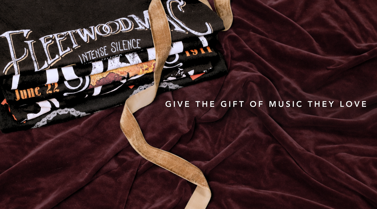 Little Lies Fleetwood Mac band tees folded and styled as rock-inspired gifts and vintage music merchandise