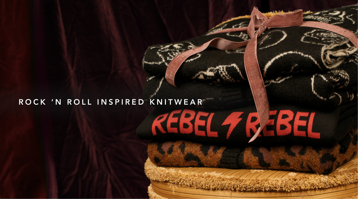 Little Lies Rebel Rebel knit jumper folded with a leopard and skull print knits, showcasing cosy winter gifting and rock-inspired fashion accessories