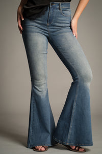 Side view of the Hendrix Blue Denim Flares showing high-waist fit and bell-bottom flare.