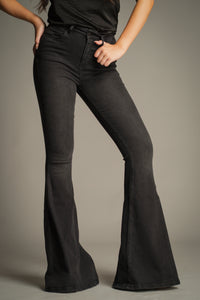 Hendrix Denim Flares in washed black featuring a high-rise waist, fitted leg and statement flared silhouette