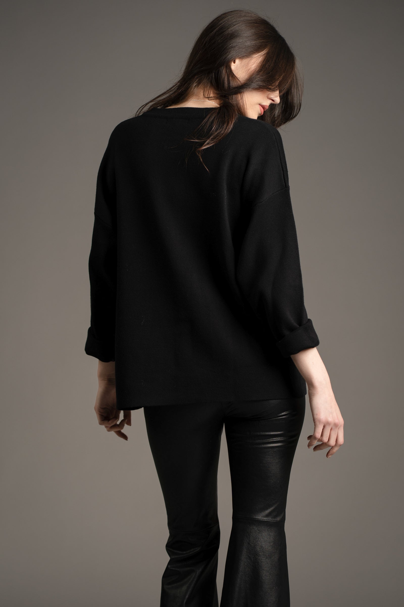 Little Lies Hendrix faux leather flared trousers in black – back view styled with oversized Rebel Rebel sweater