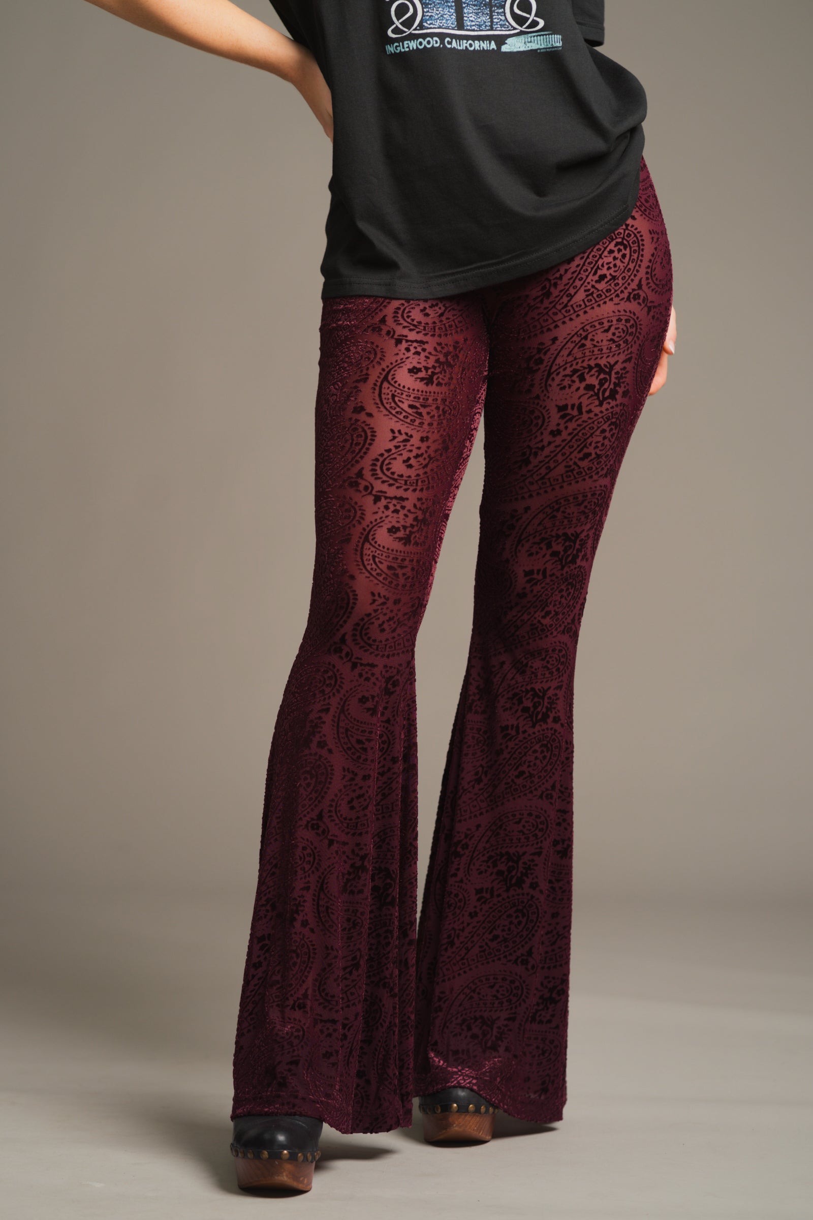 Close-up of plum burnout velvet fabric with paisley devore pattern on 70s inspired Hendrix Flares.