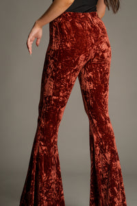 Close-up back view of Hendrix Rust Crushed Velvet Flares highlighting the crushed velvet texture and premium rust-coloured finish