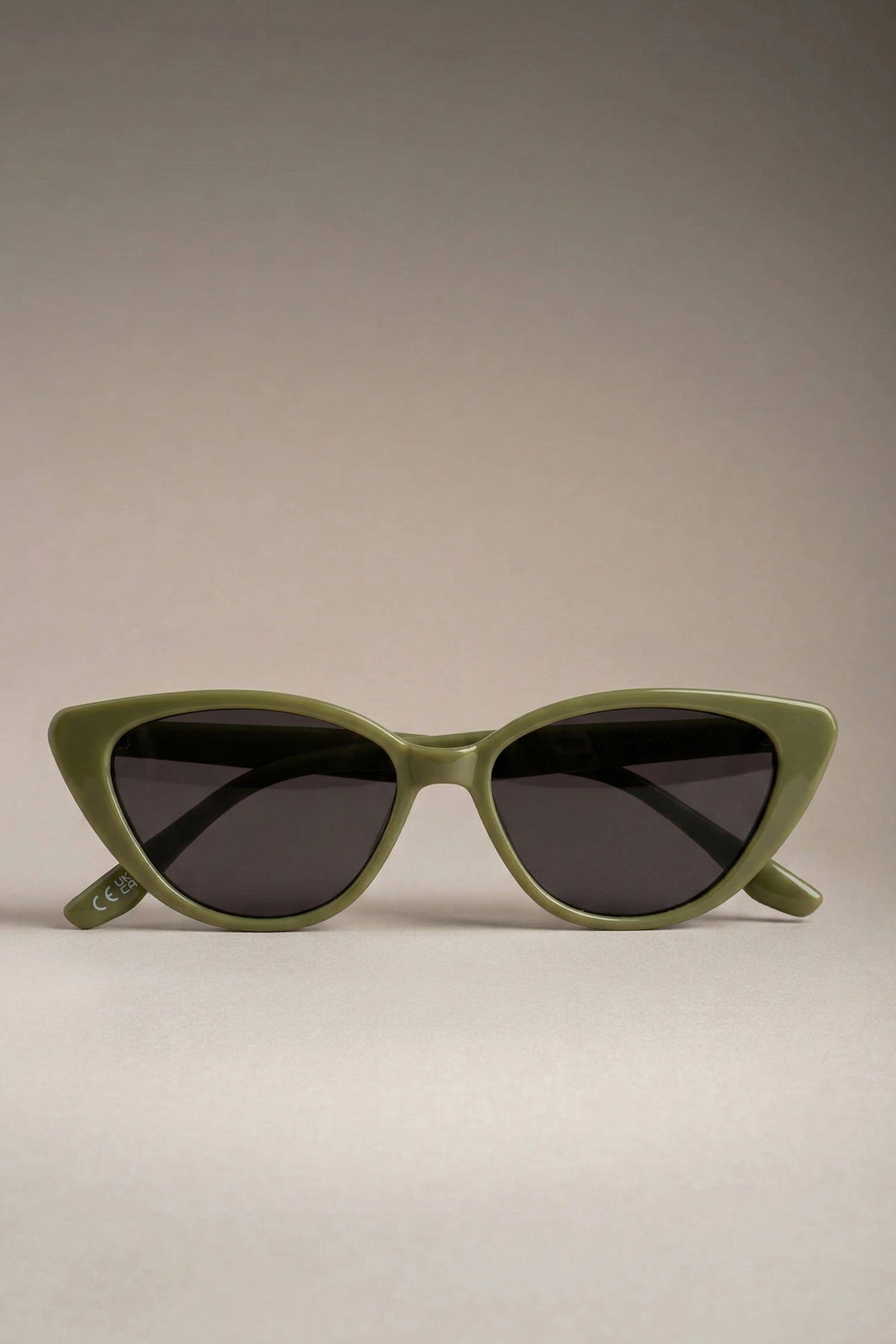 Olive cat eye retro sunglasses front view with dark tinted lenses