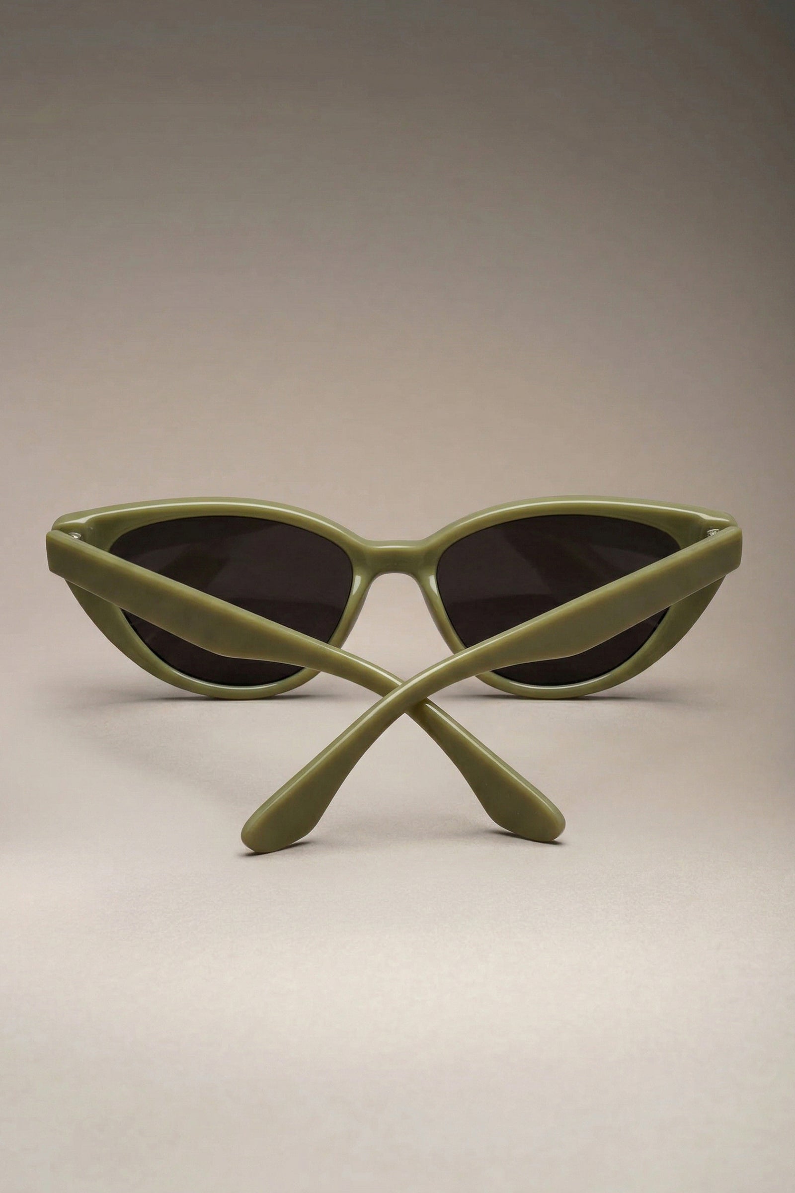 Olive cat eye sunglasses folded with slim retro frame