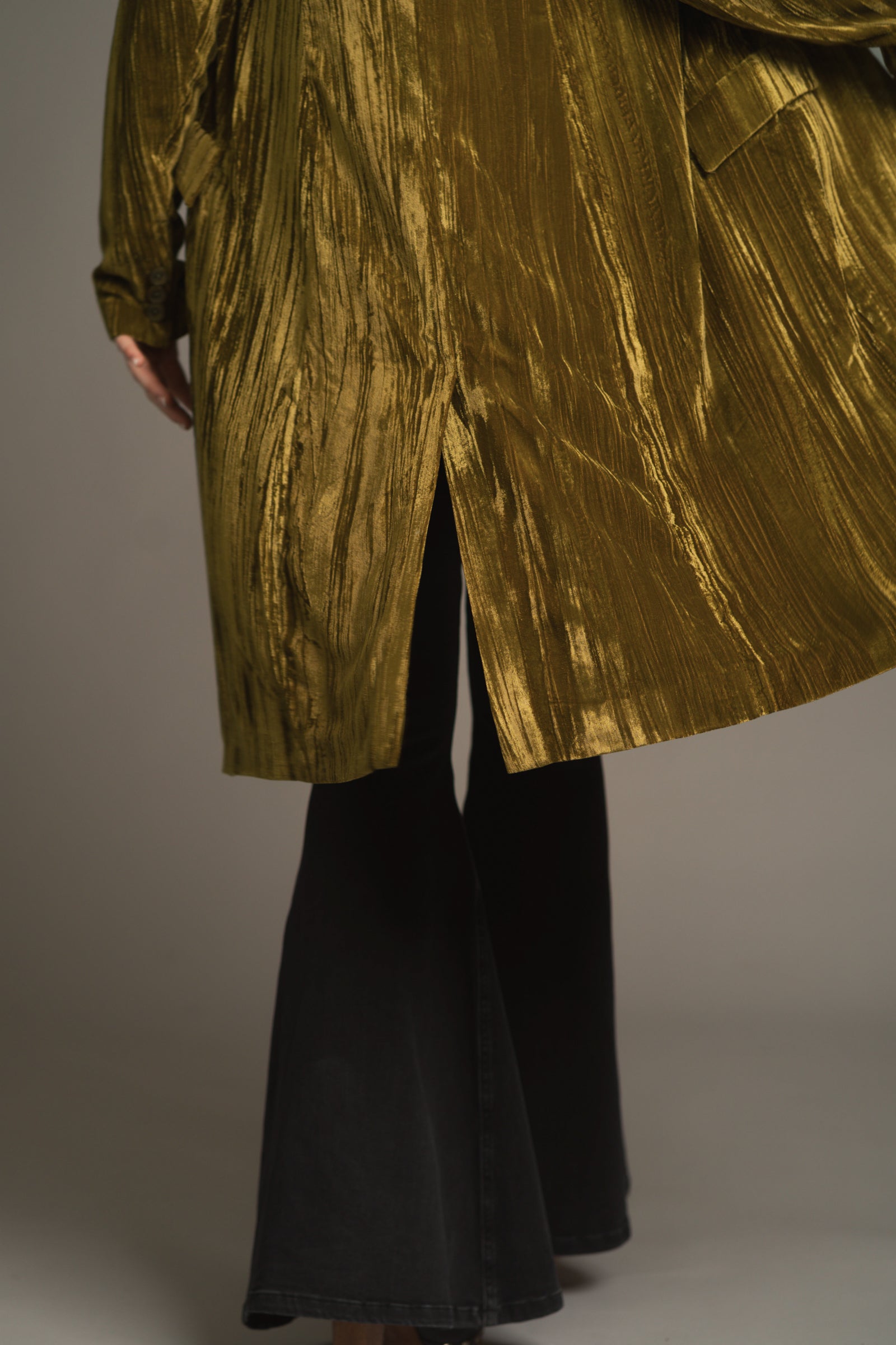 Back view of Jagger Olive jacket highlighting relaxed tailoring and dramatic length.