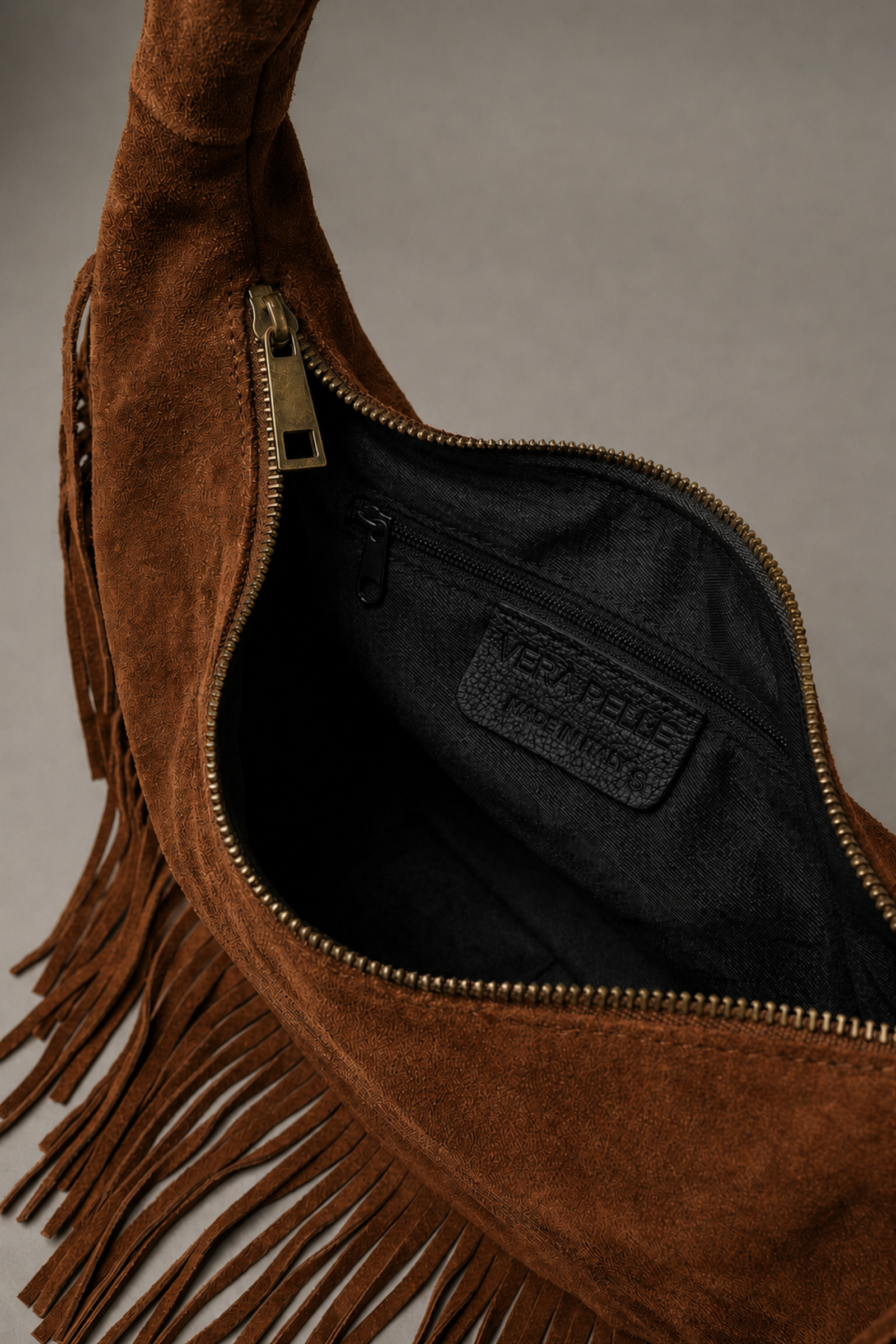 Little Lies Kate tan suede studded bag – inside view with zip compartment detail