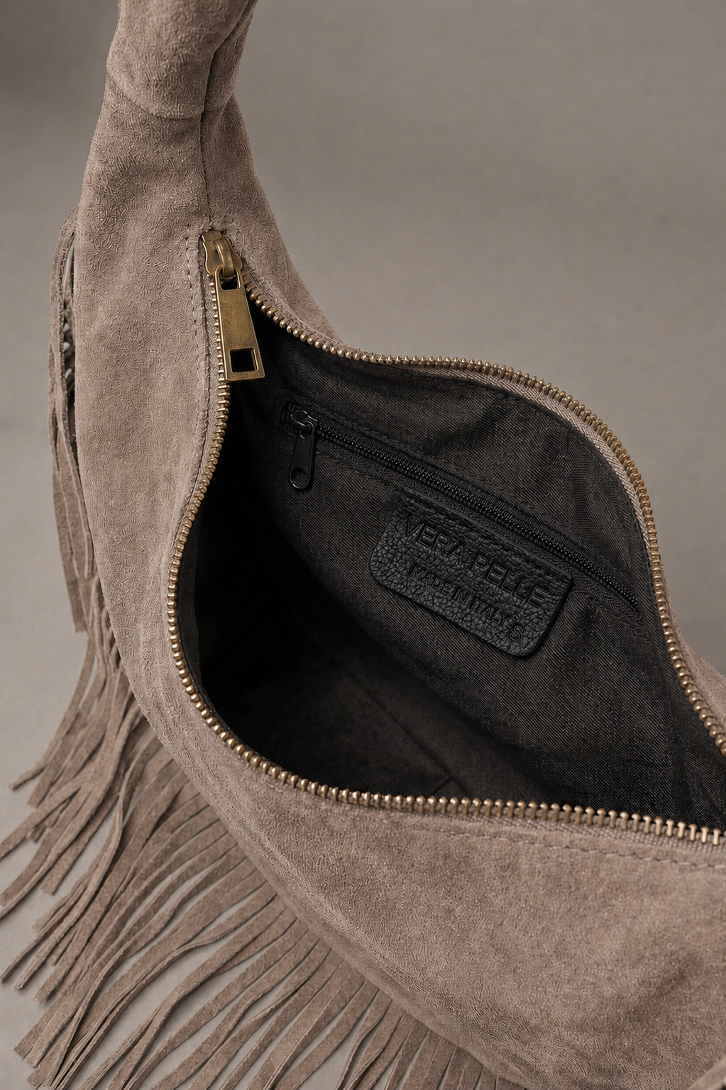 Little Lies Kate taupe genuine suede studded fringe bag with zip closure and inner pocket, interior detail view