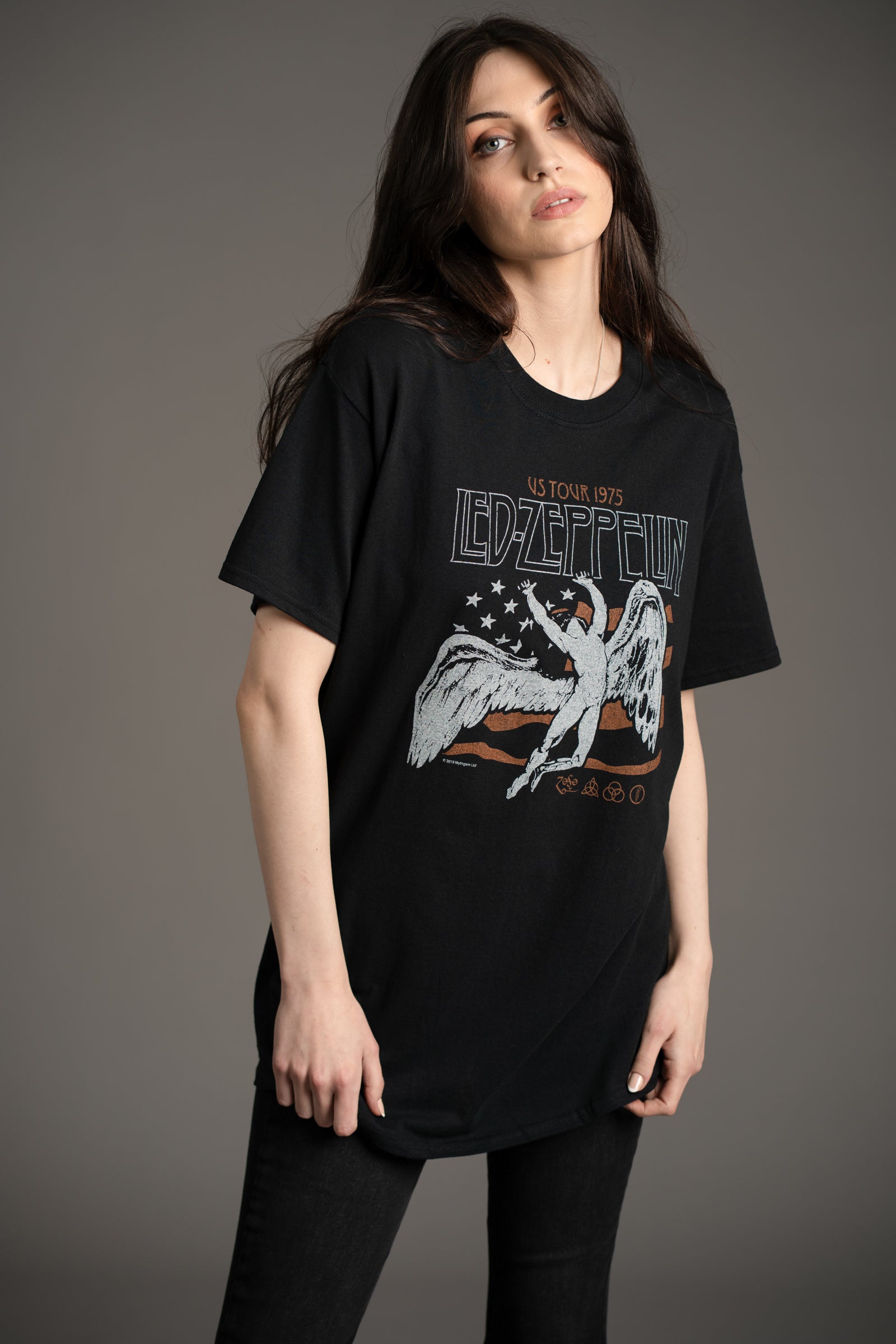 Model Andie wearing the Led Zeppelin 1975 Band graphic tee styled with Hendrix Denim flares from Little Lies