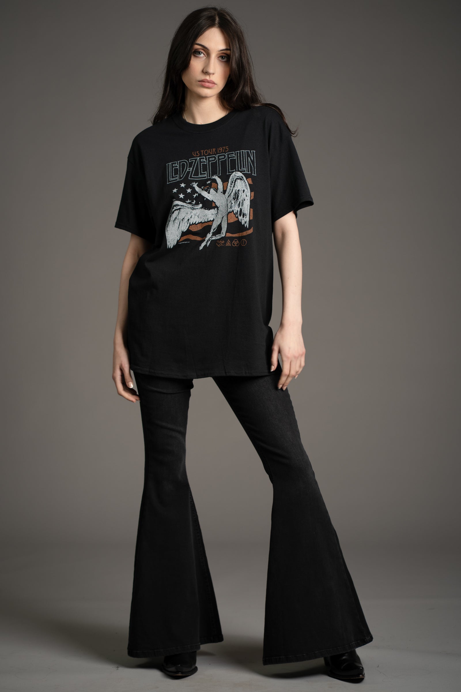 Model Andie wearing the Led Zeppelin 1975 Band graphic tee styled with Hendrix Denim flares from Little Lies