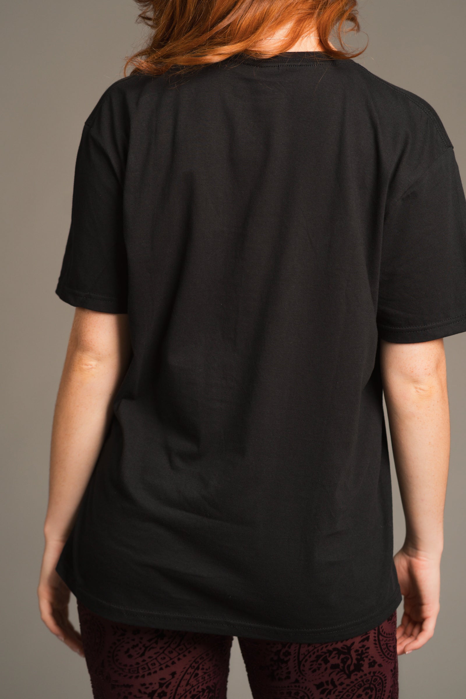 Anna showing the back of the Led Zeppelin Inglewood Band Tee over the Hendrix Plum Devore Velvet Flares for an effortless boho vibe.