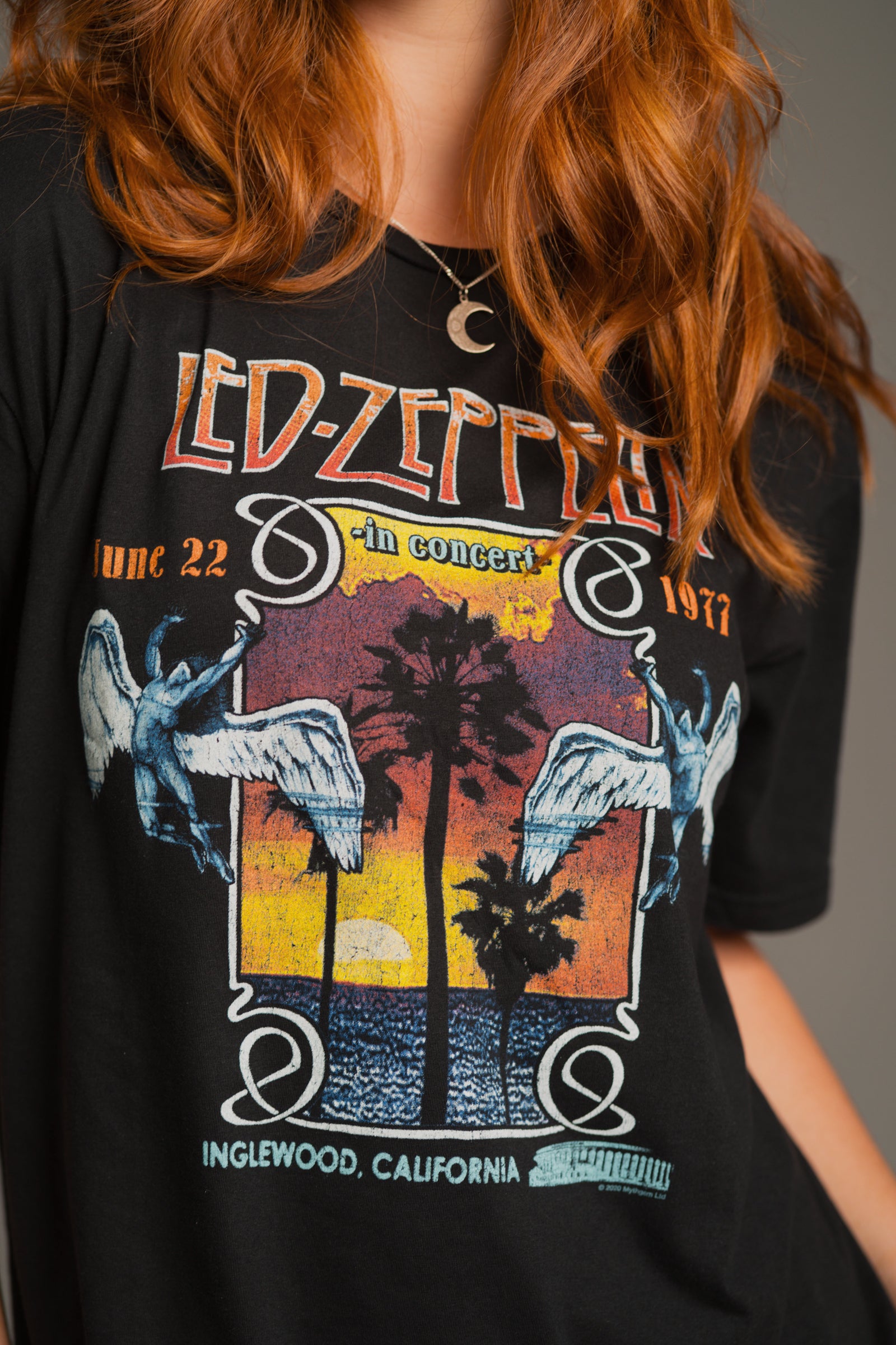 Close up of the Led Zeppelin Inglewood Band Tee with graphic print, paired with the Sterling Silver Crescent Moon Pendant for effortless chic.