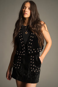 Close-up of the Lennon Studded Velvet Mini Skirt highlighting silver stud detailing, premium crushed velvet fabric and front pocket design