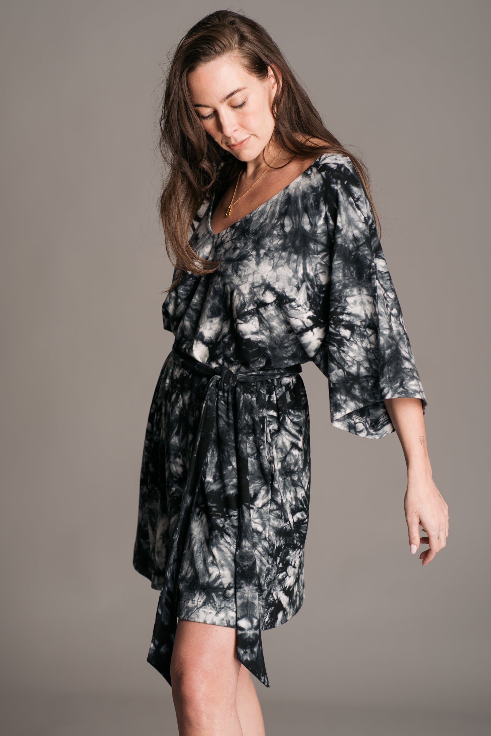 Joplin Tie Dye Mini Dress worn onset by brunette model, Bex, also wearing black leather wooden clogs.