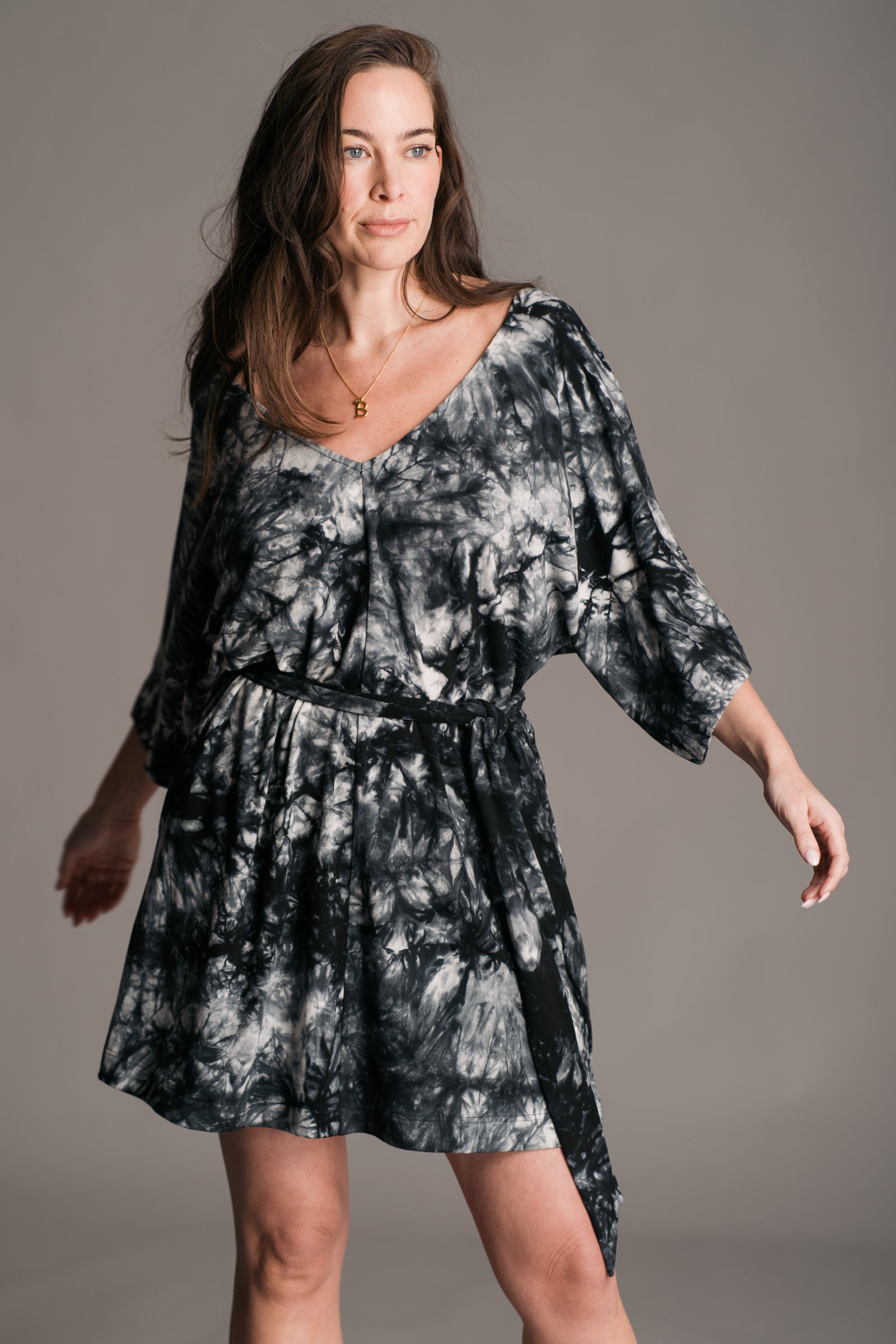 Joplin Tie Dye Mini Dress worn onset by brunette model, Bex, also wearing black leather wooden clogs.