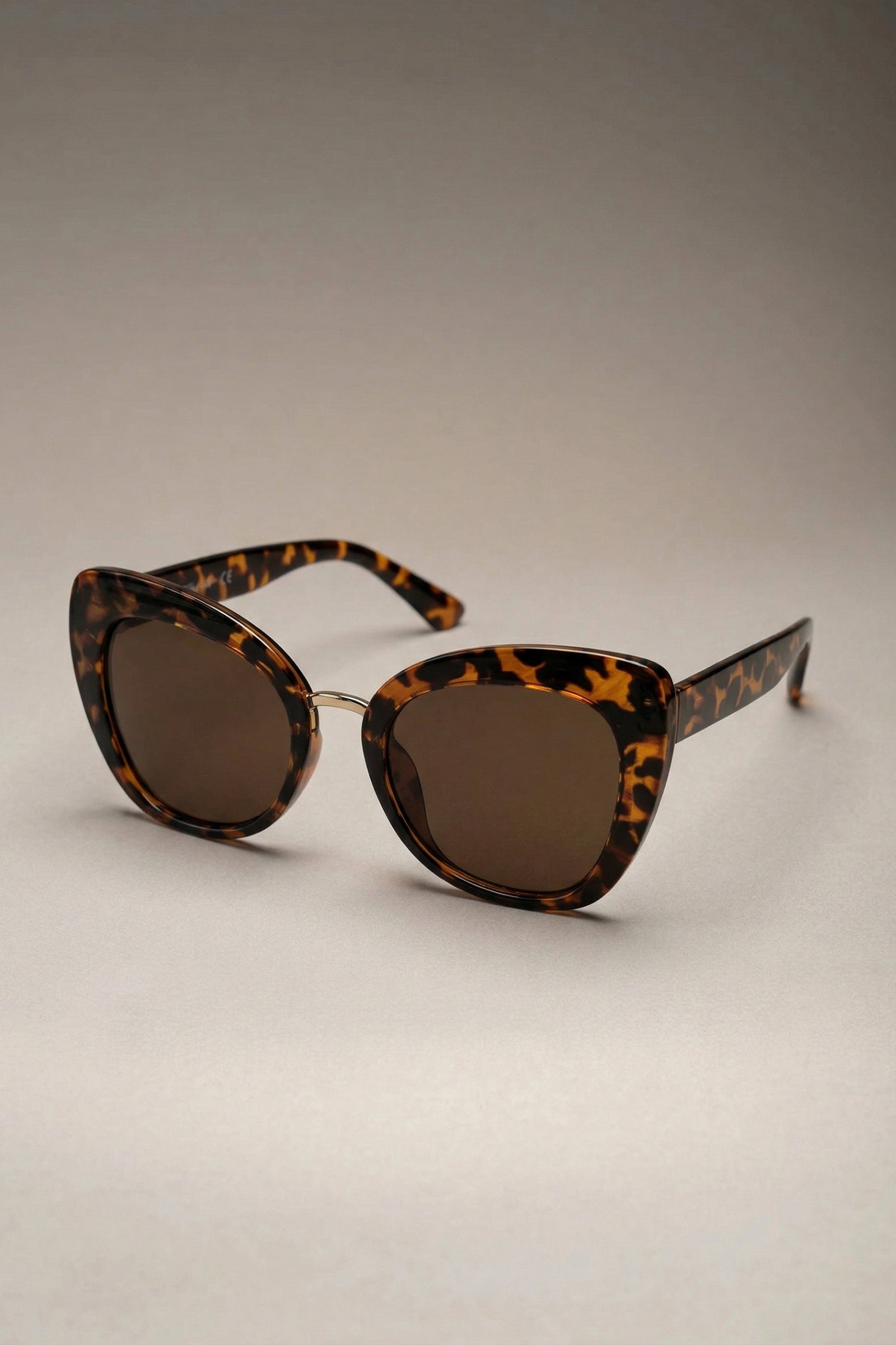 Tortoiseshell cat eye sunglasses front view with tinted lenses