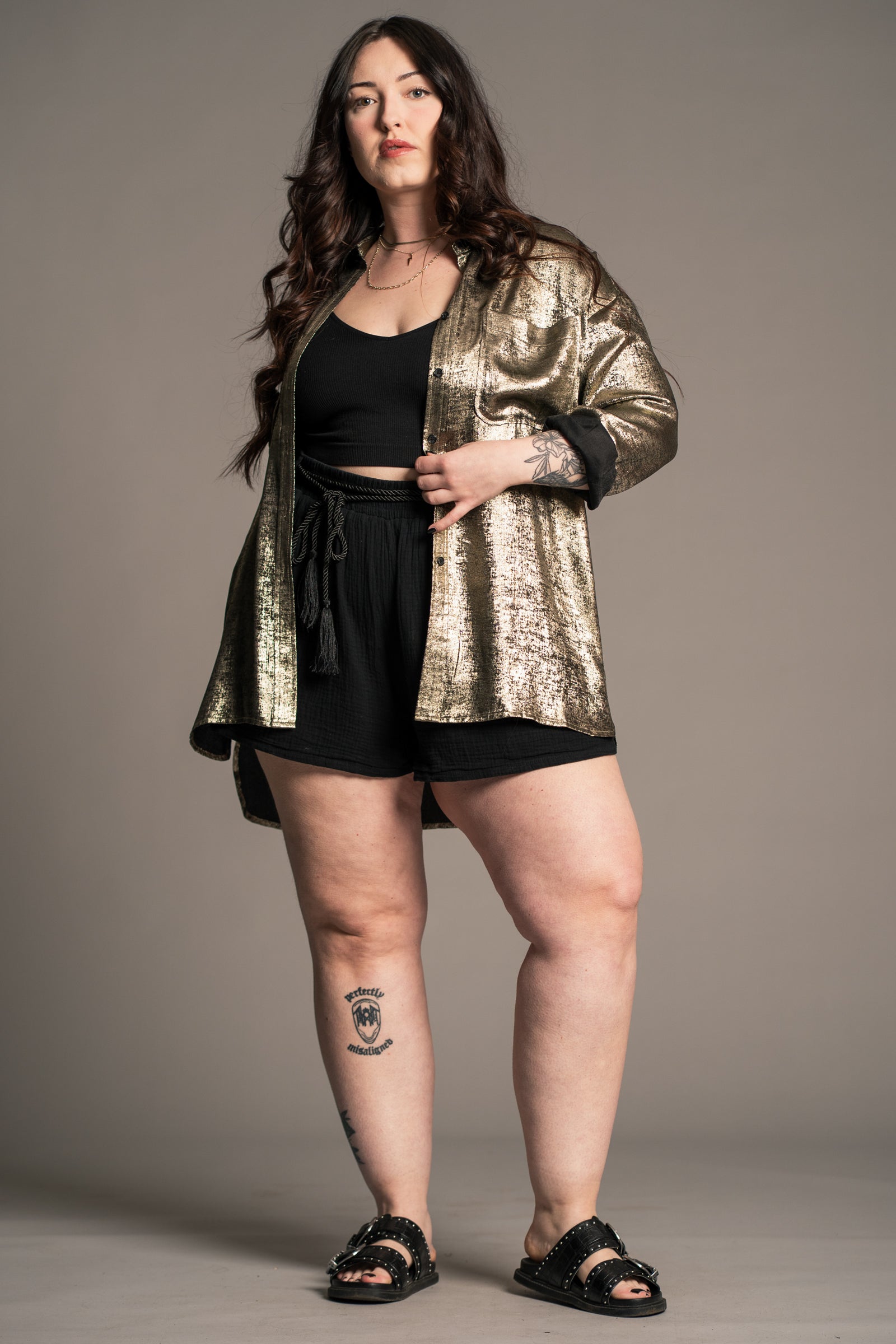 Erin wears Little Lies Luna Metallic Shirt in gold, additional styled view showing relaxed longline fit