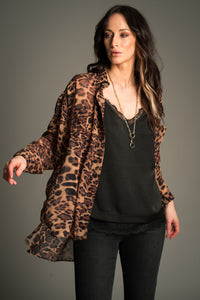 Victoria wears Little Lies Mosshart Leopard Chiffon Shirt in brown and black, lightweight sheer longline design styled open, over a black satin cami and skinny jeans.