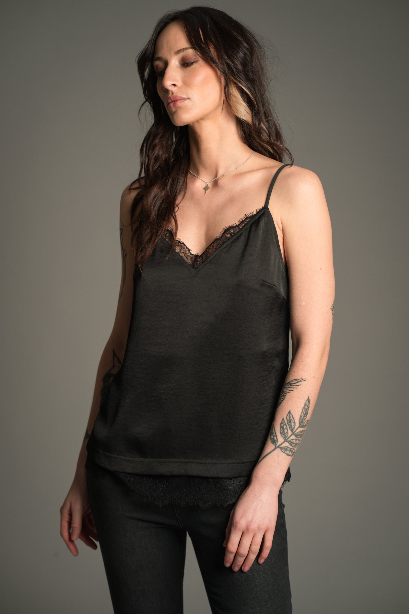 Victoria wears Little Lies Nightbird Lace Trim Cami Top in black, front view showing lace‑trim neckline and hem.
