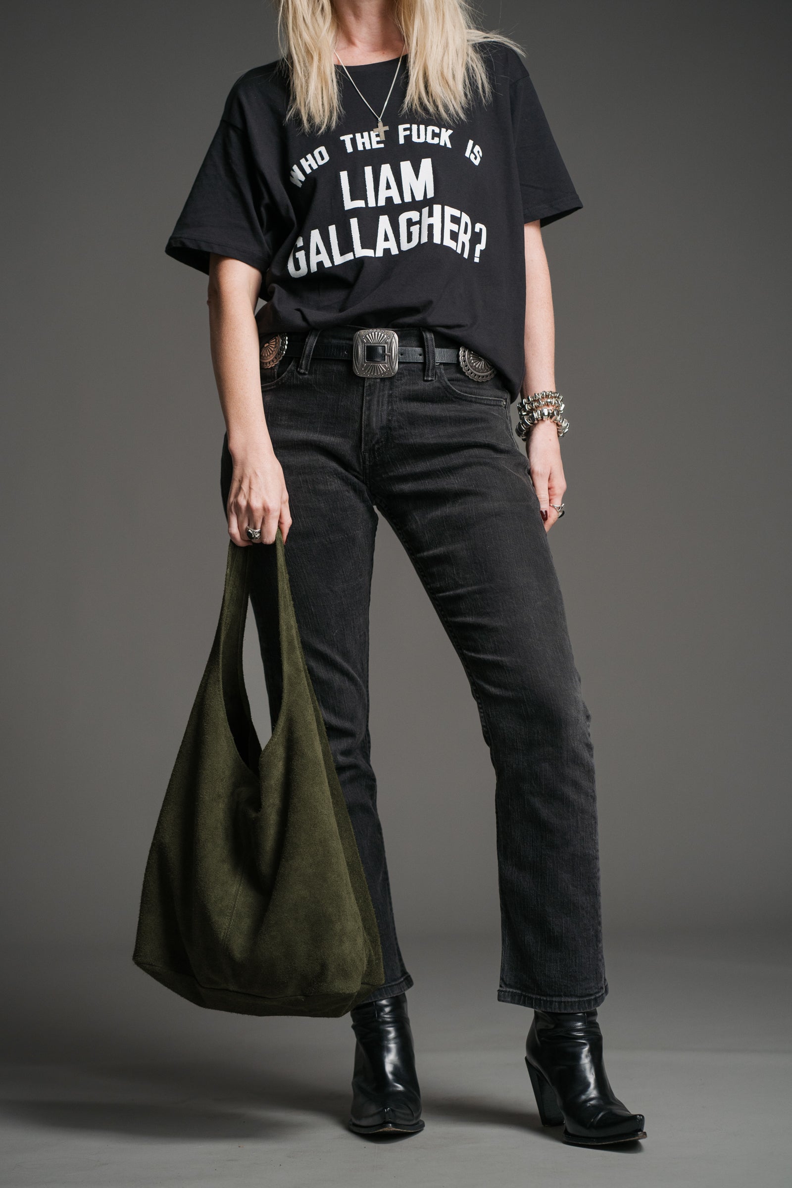 Olsen Khaki Genuine Suede Slouchy Bag styled with a black graphic tee and dark denim jeans.