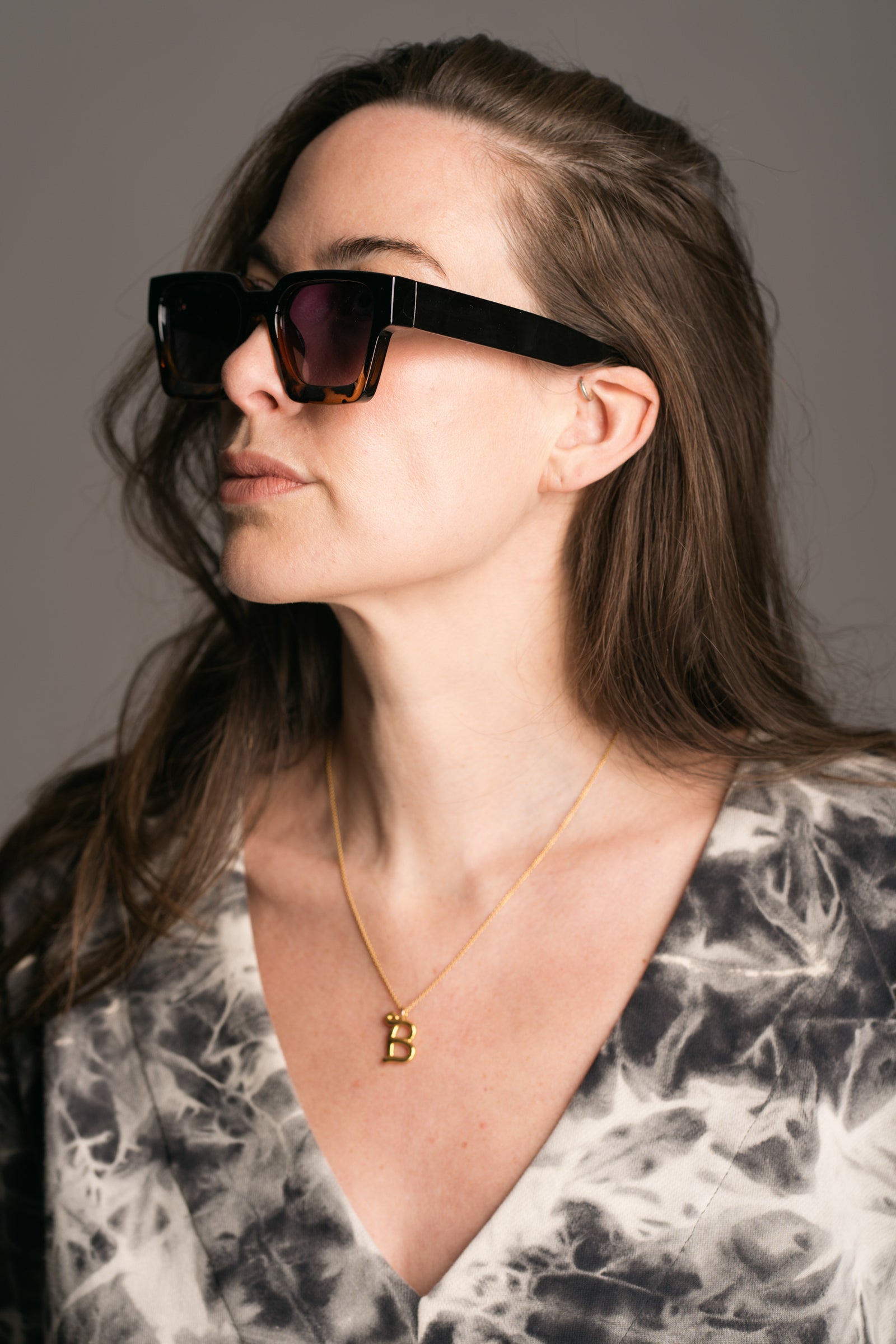 Chrissie Wayfarer Shades work by brunette model wearing the Nevermind Midi Tie Dye Dress