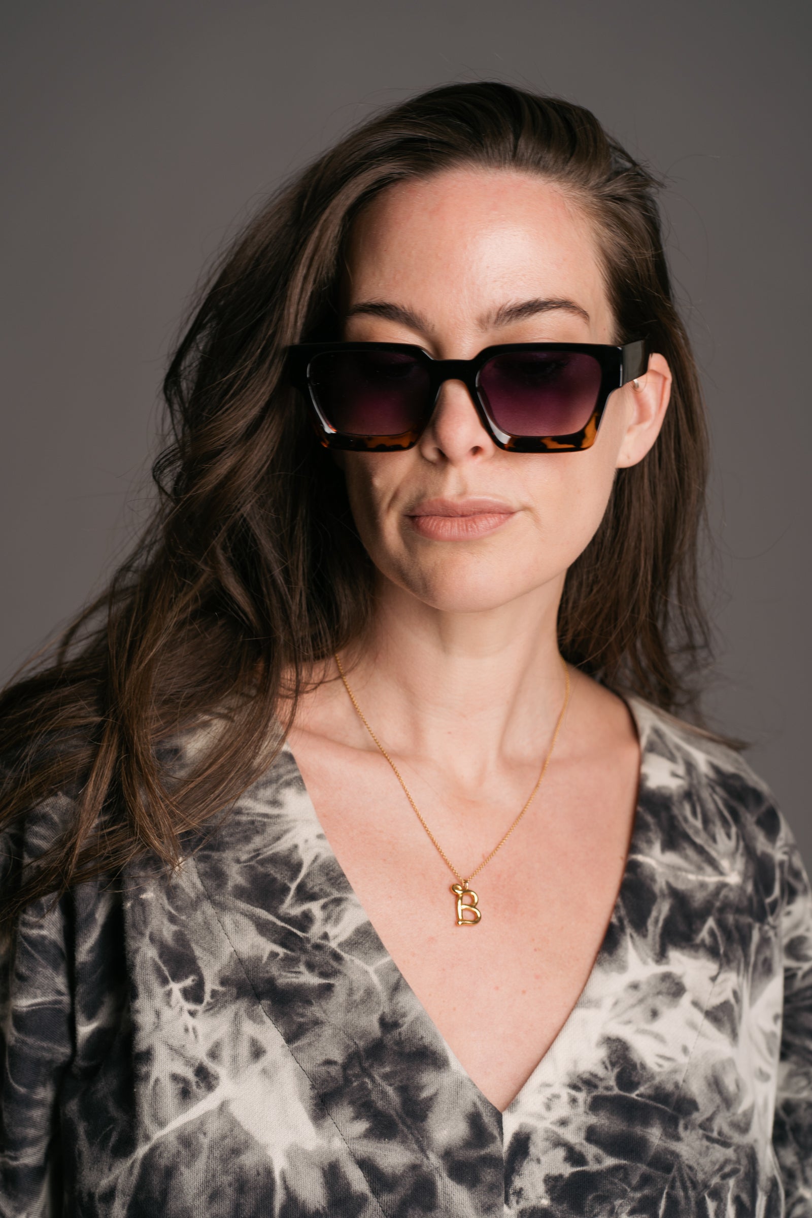 Chrissie Wayfarer Shades work by brunette model wearing the Nevermind Midi Tie Dye Dress