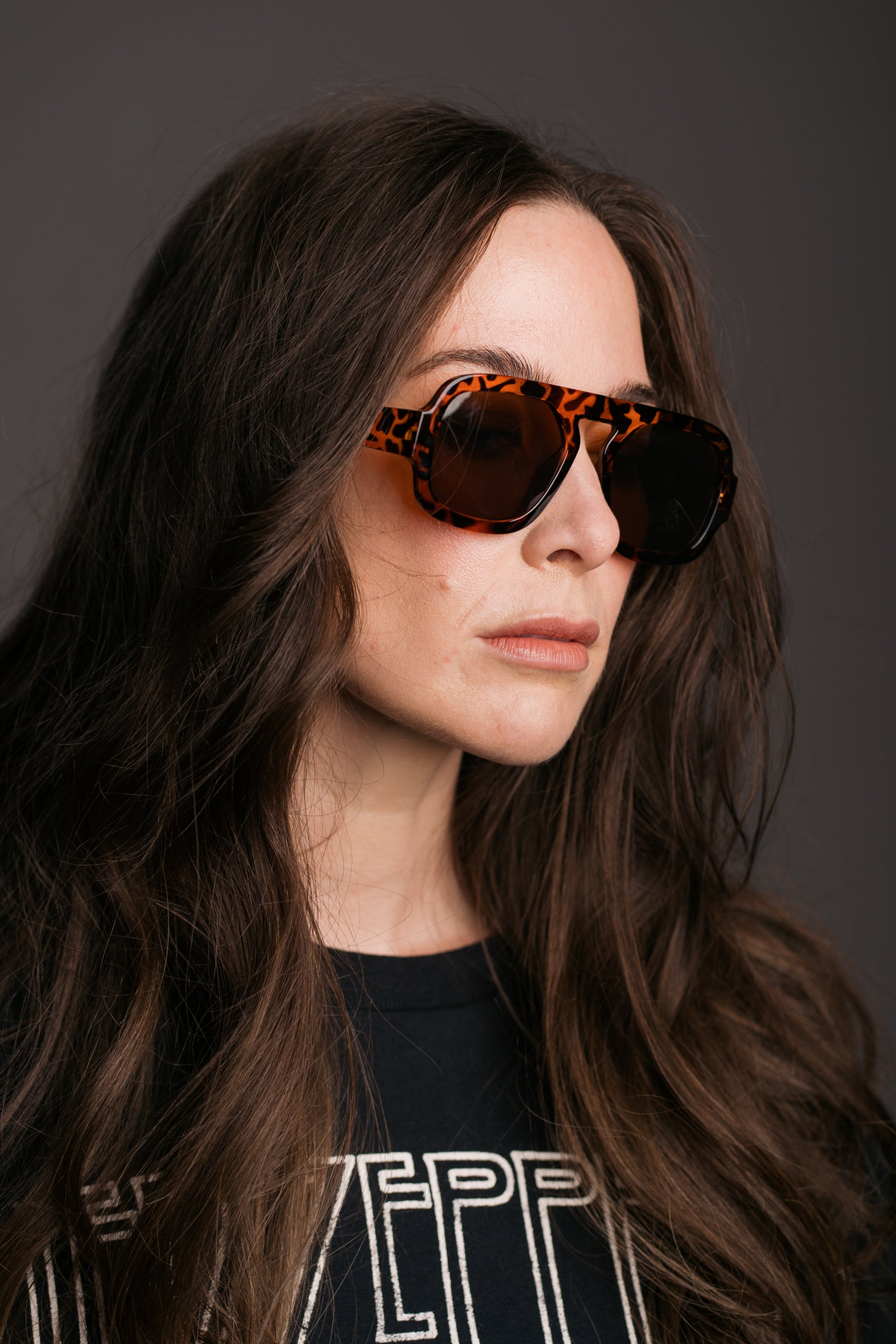 Lenny Tortoiseshell Aviator Shades worn by brunette model in Led Zeppelin Band Tee