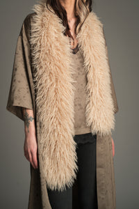 Little Lies Penny Lane faux Mongolian fur scarf in soft beige shown draped on model.